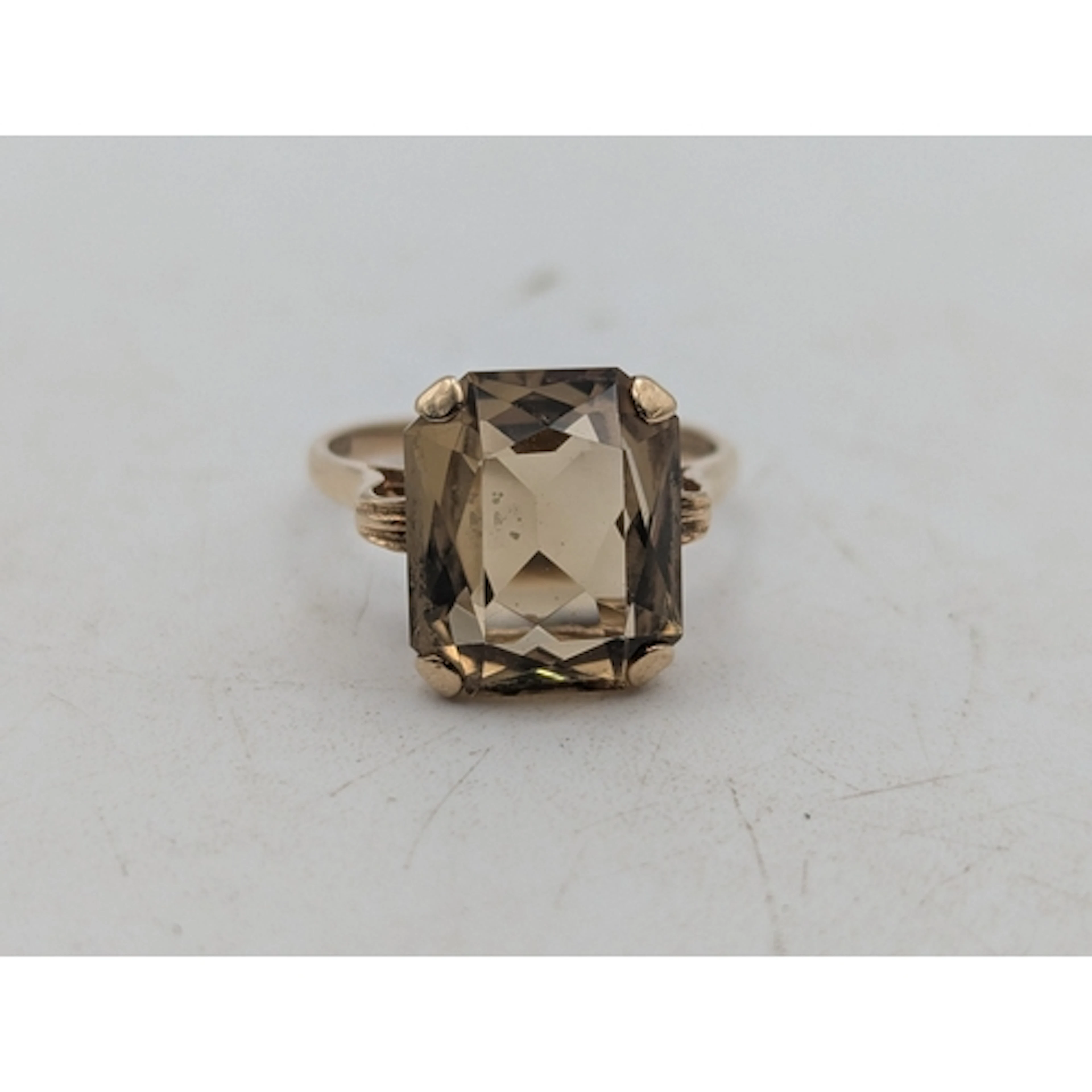 A citrine and 9ct yellow gold cocktail ring, featuring an em...