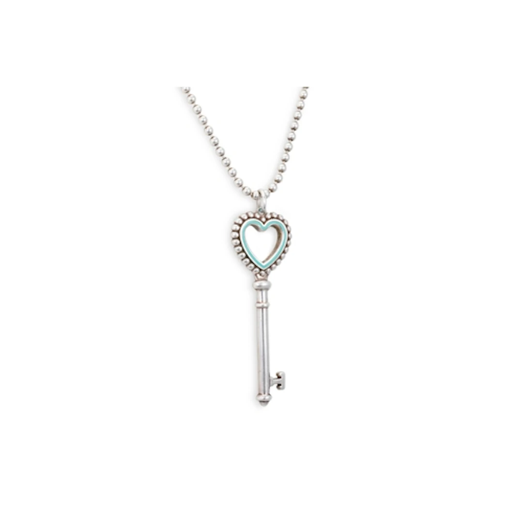 A SILVER TIFFANY PENDANT AND CHAIN, modelled as a key, on a ...