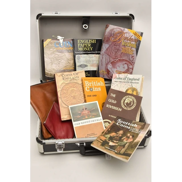 An aluminium case containing 9 books of numismatic interest,...
