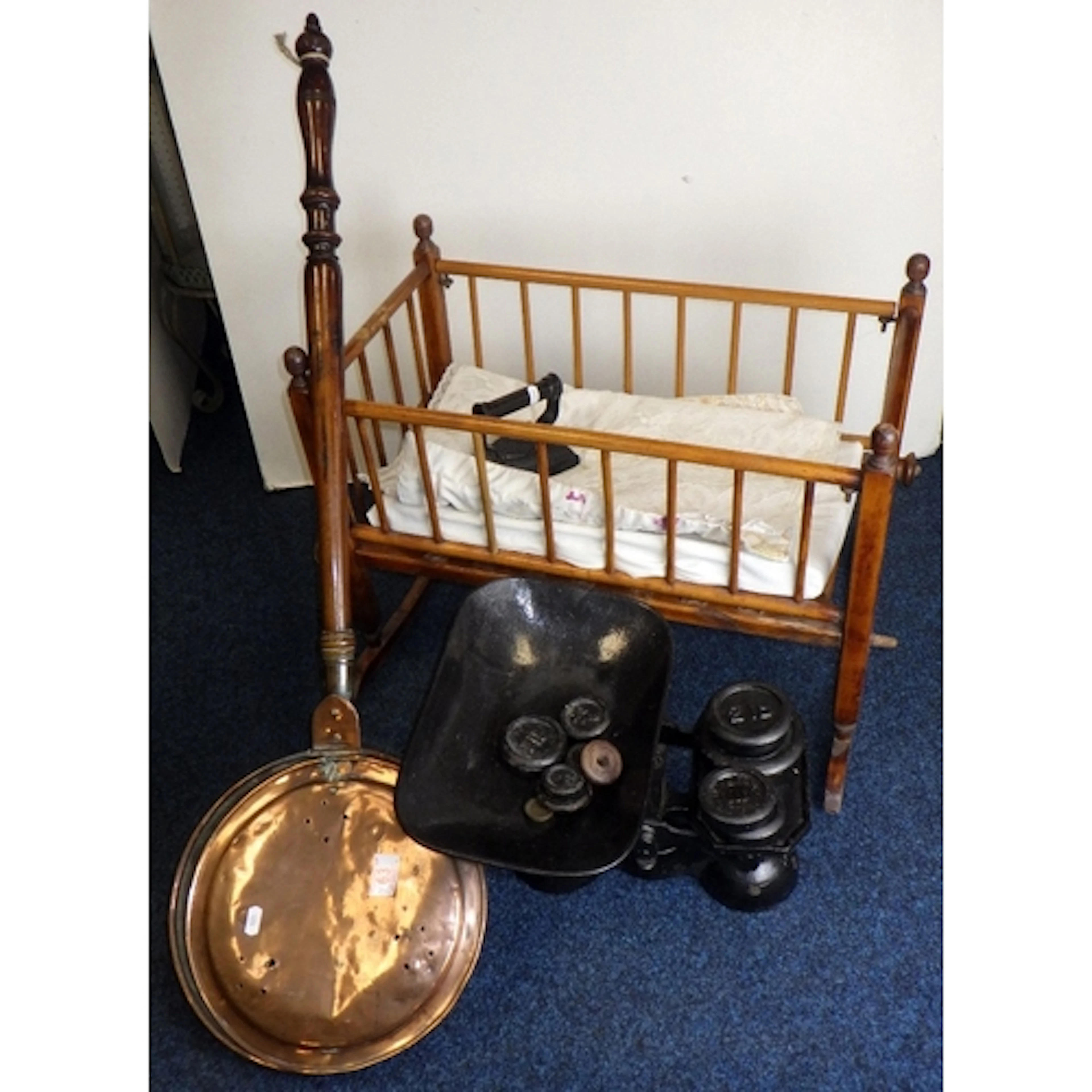 A doll's crib, cast scales with weights & a bed warmer (3)