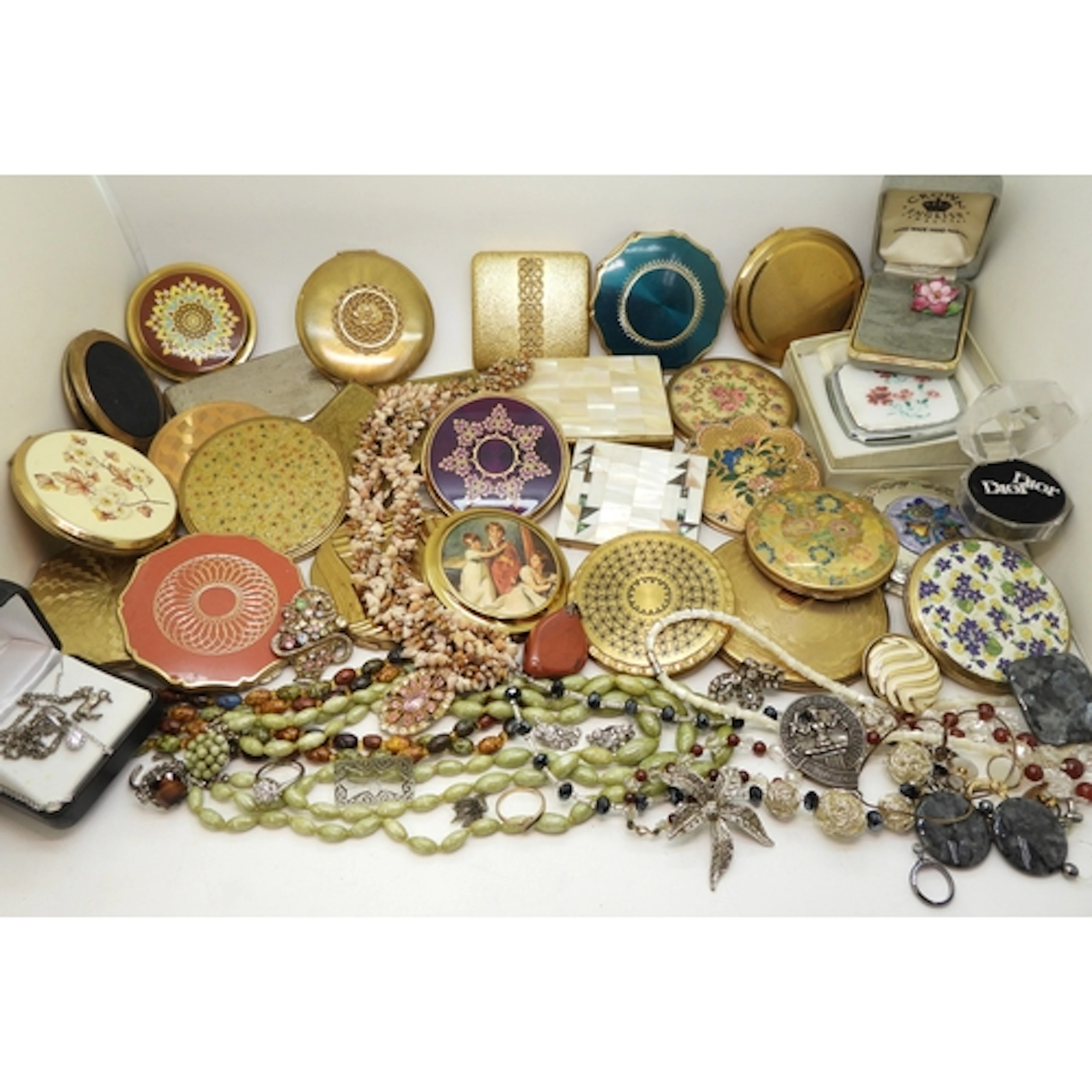 A collection of compacts to include, Stratton, Kigu, Avon, ...