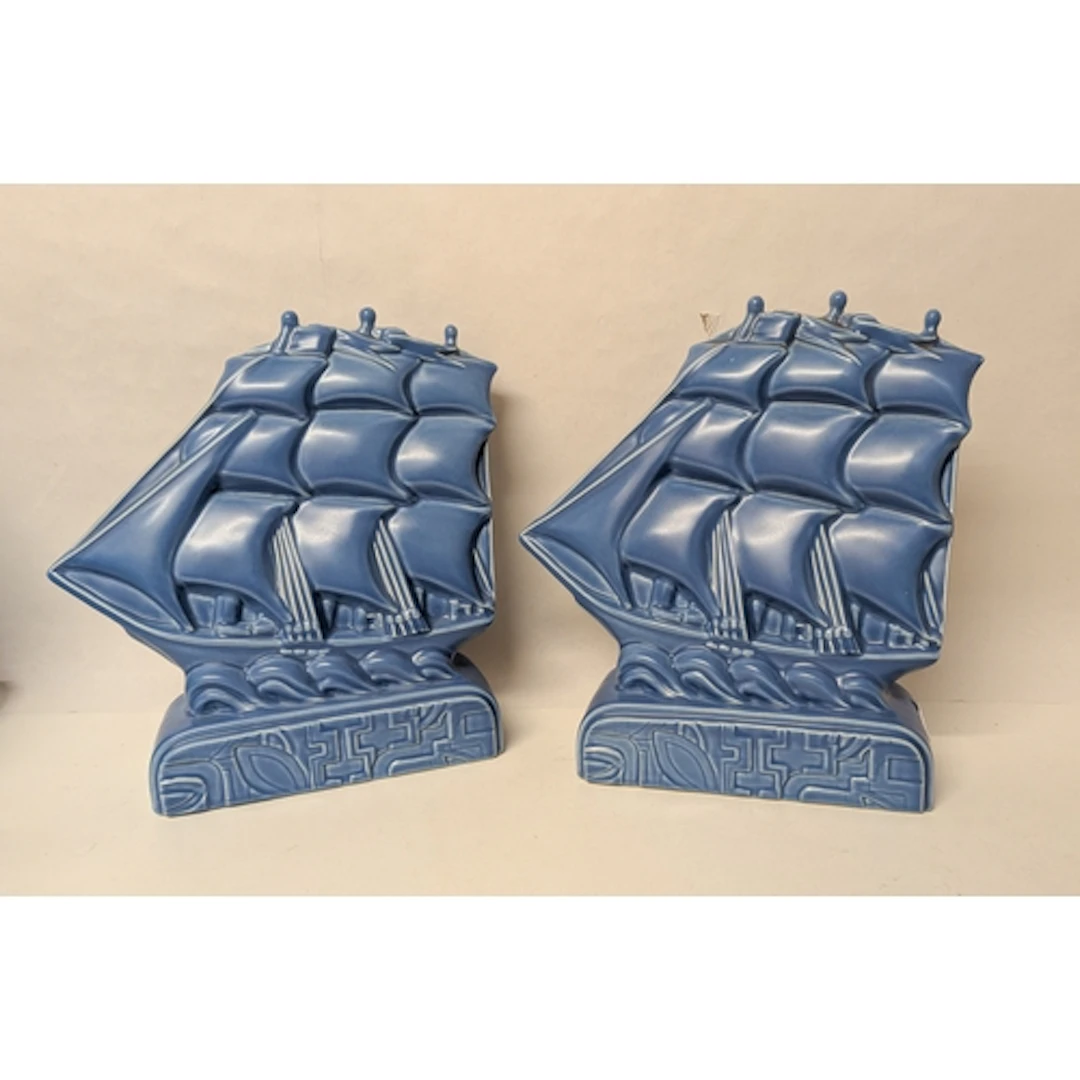 A pair of modern Poole Studio blue sprayed Galleon bookends