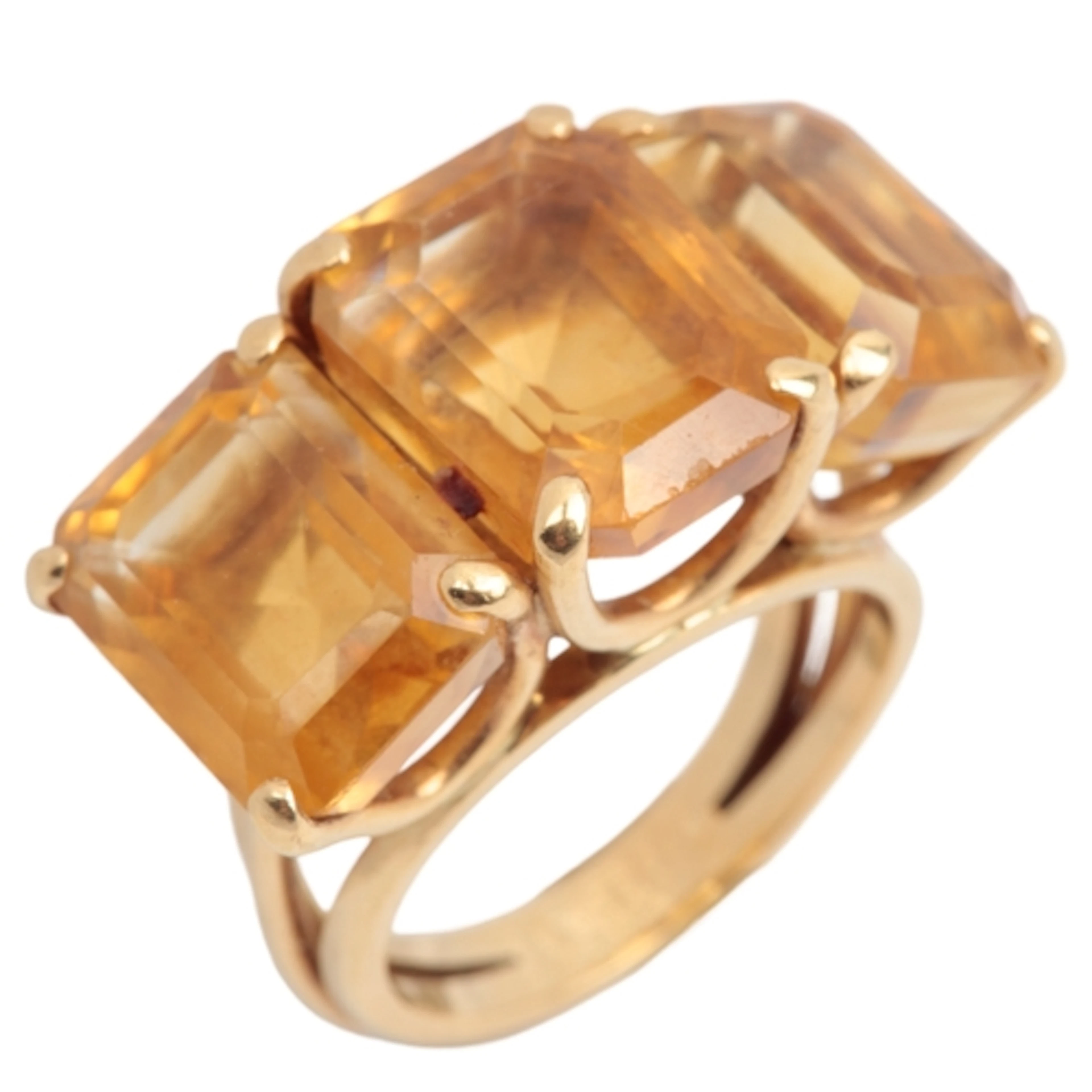 A citrine cocktail ring, claw-set with three step-cut citrin...