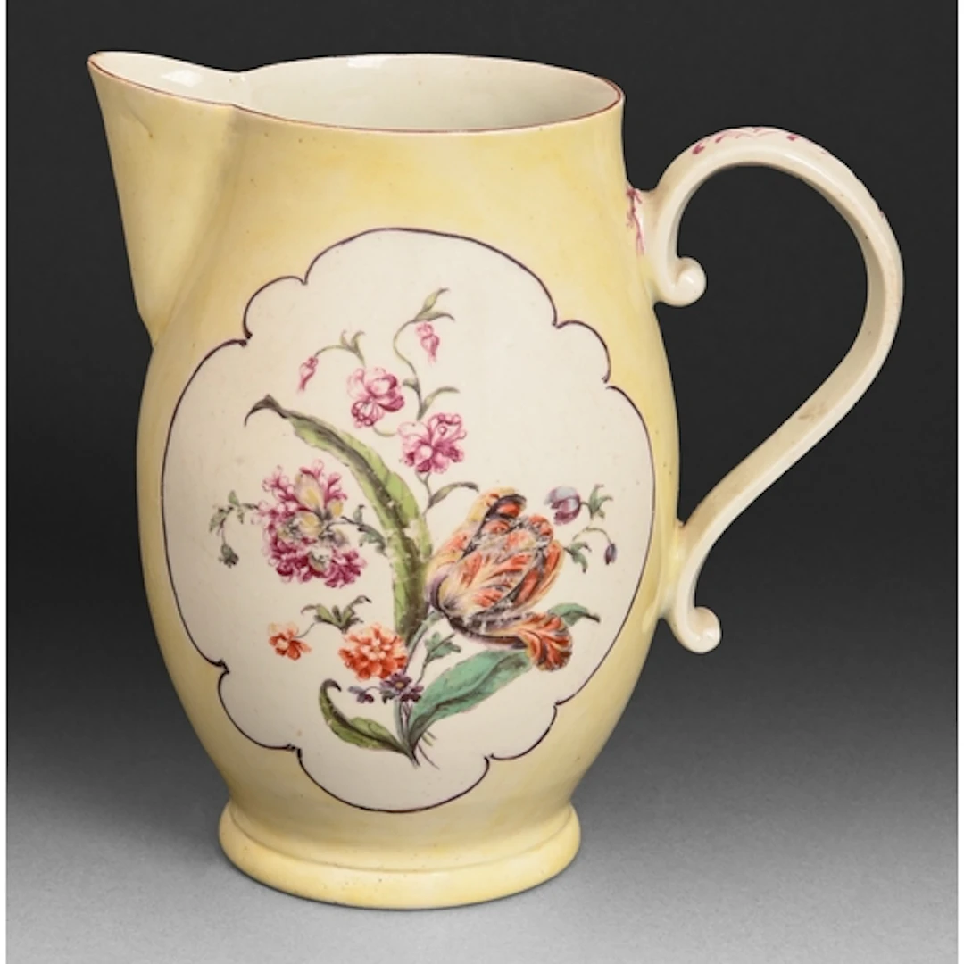 A Derby jug, c1760-1765, painted with flowers within a puce ...