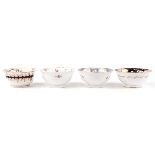 Four 19th century porcelain bowls, each with hand painted fl...