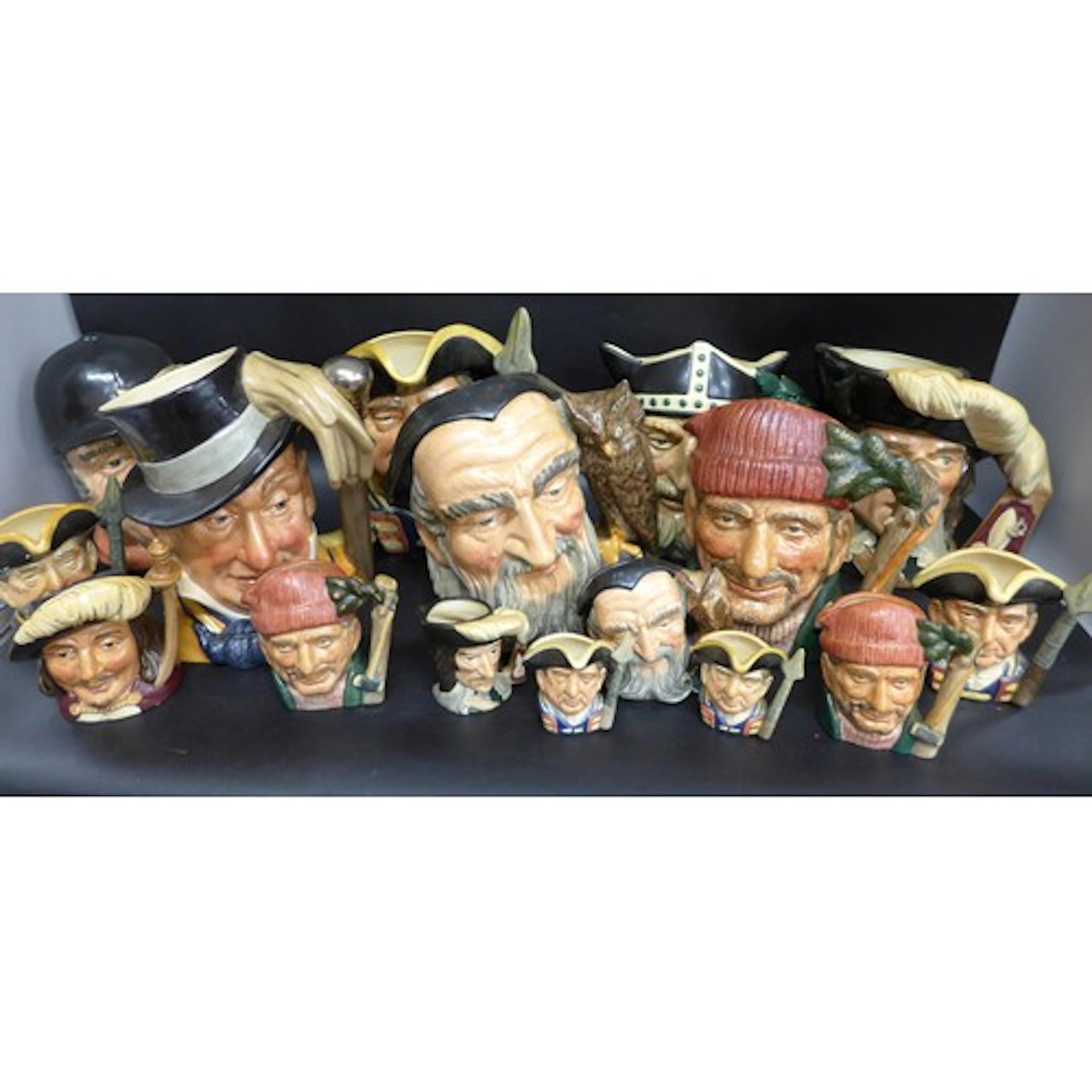 Seven large Royal Doulton character jugs and nine miniatures...