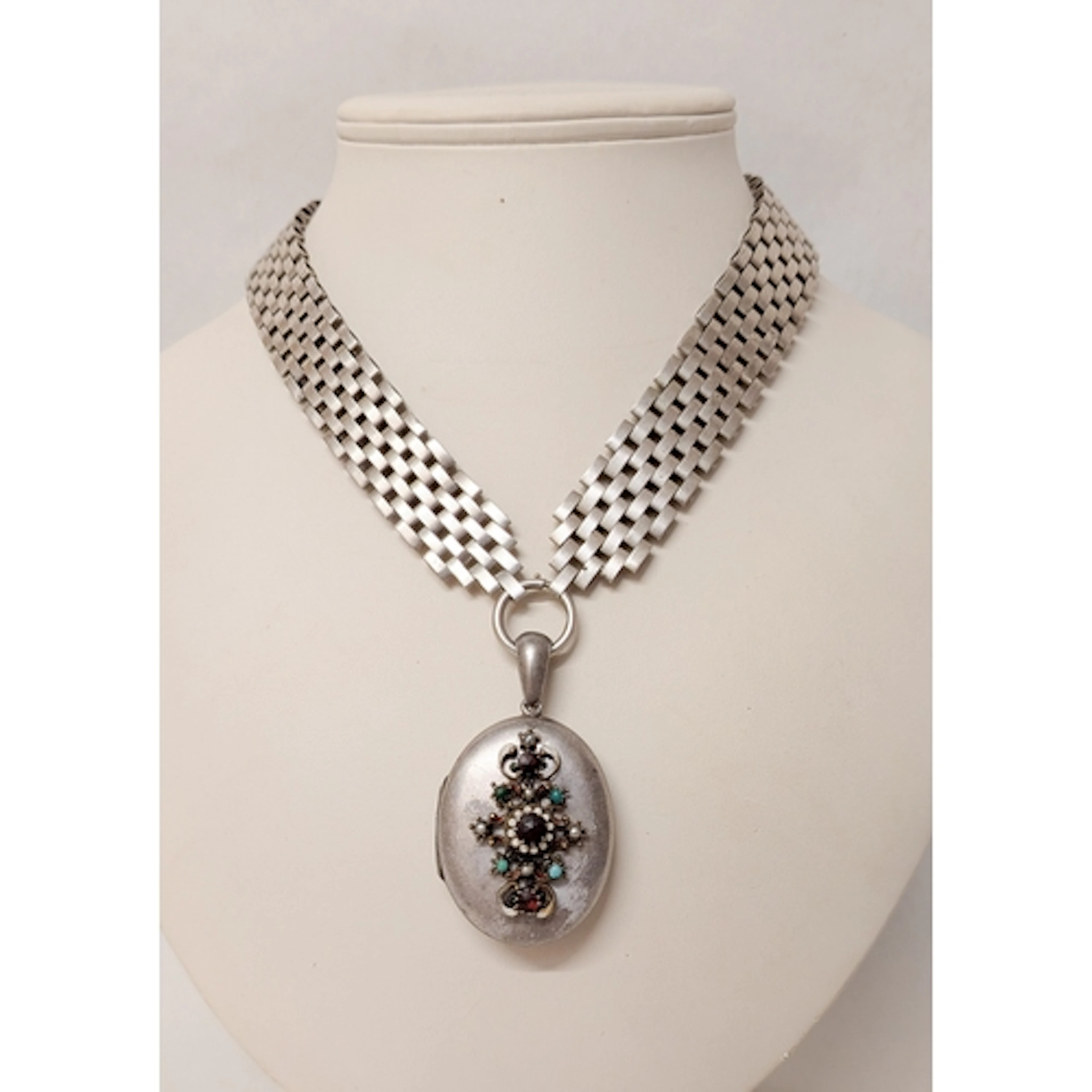 Victorian silver oval locket with engraving to one side and ...