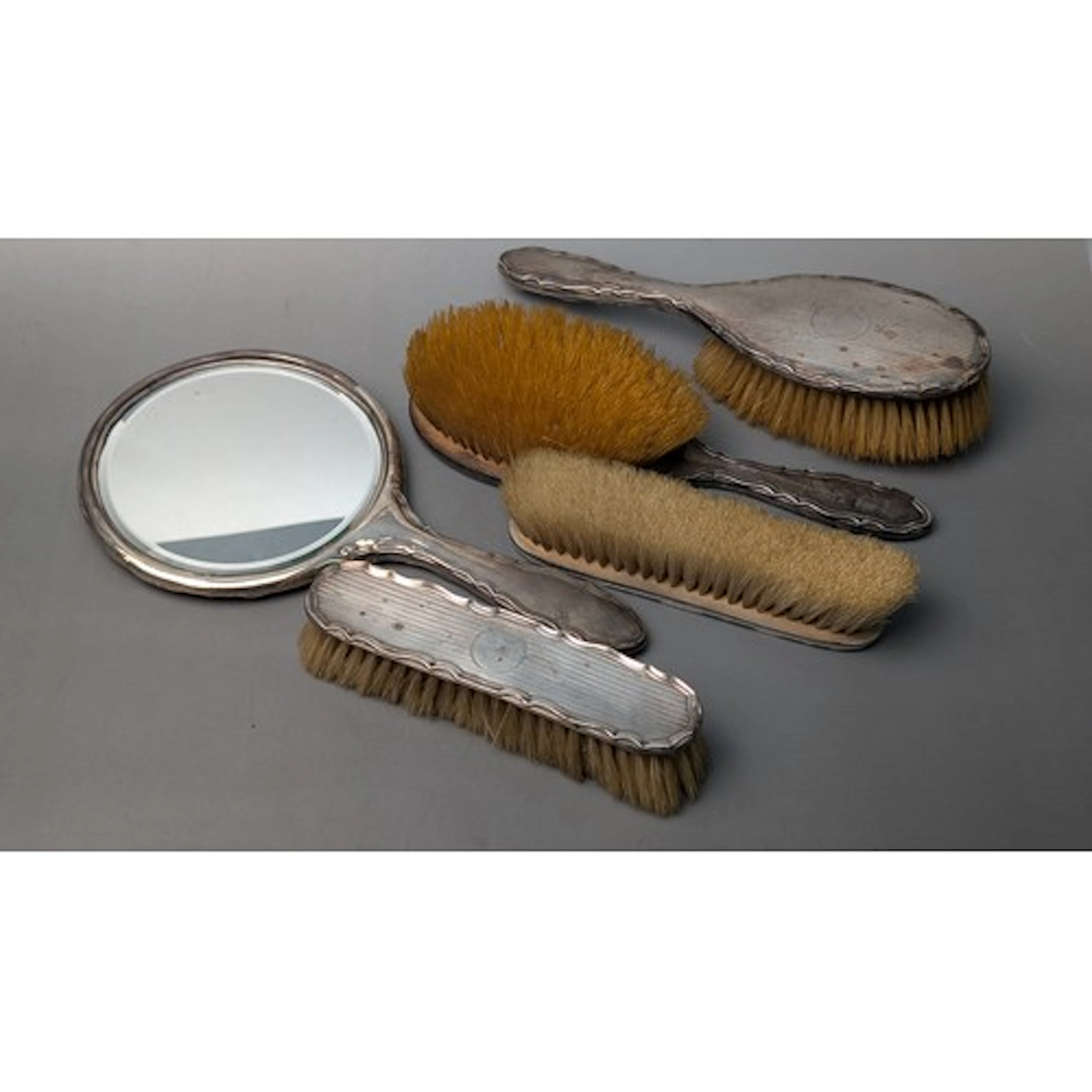 George V silver mounted engine-turned five-piece dressing ta...