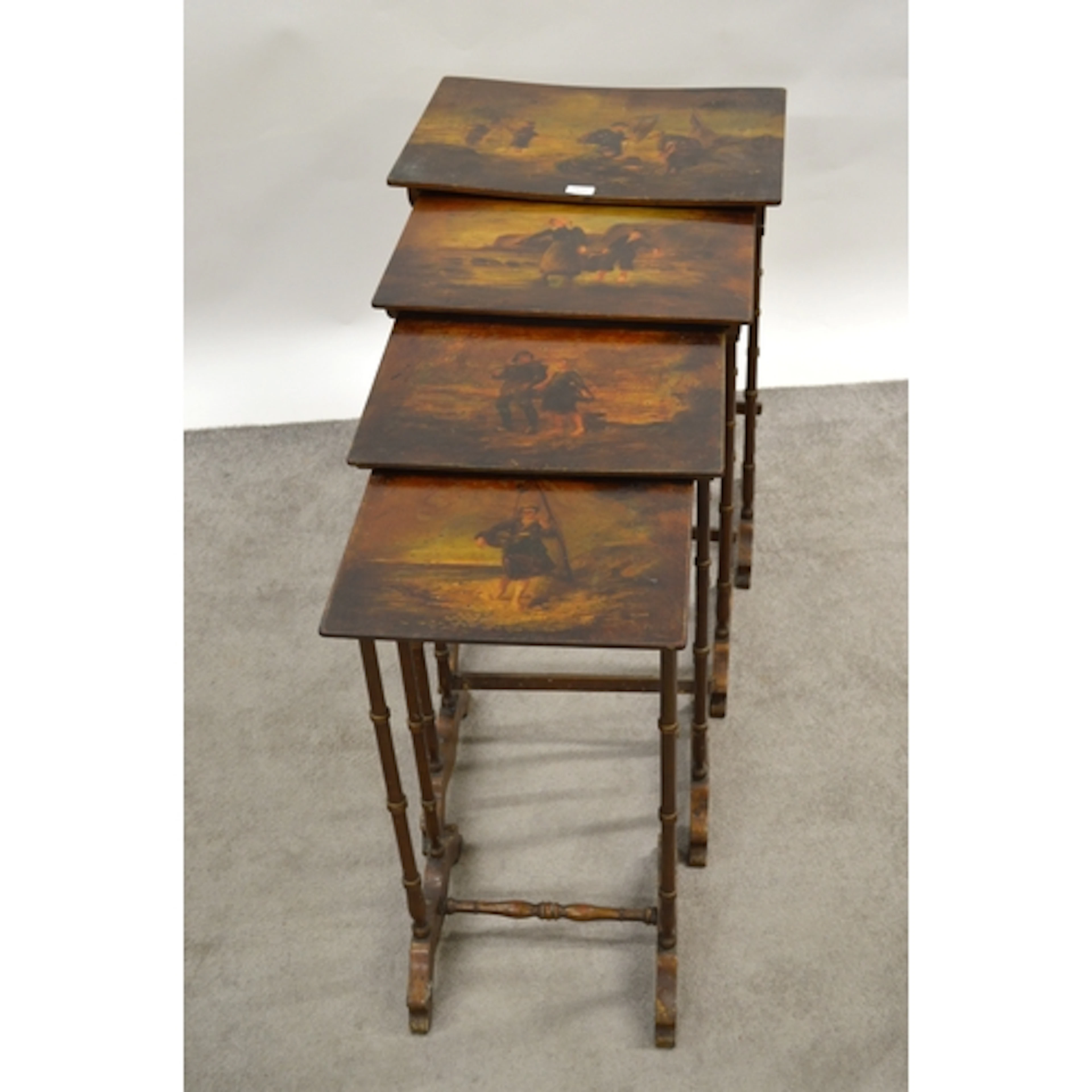 Nest of four rectangular occasional tables, each painted wit...