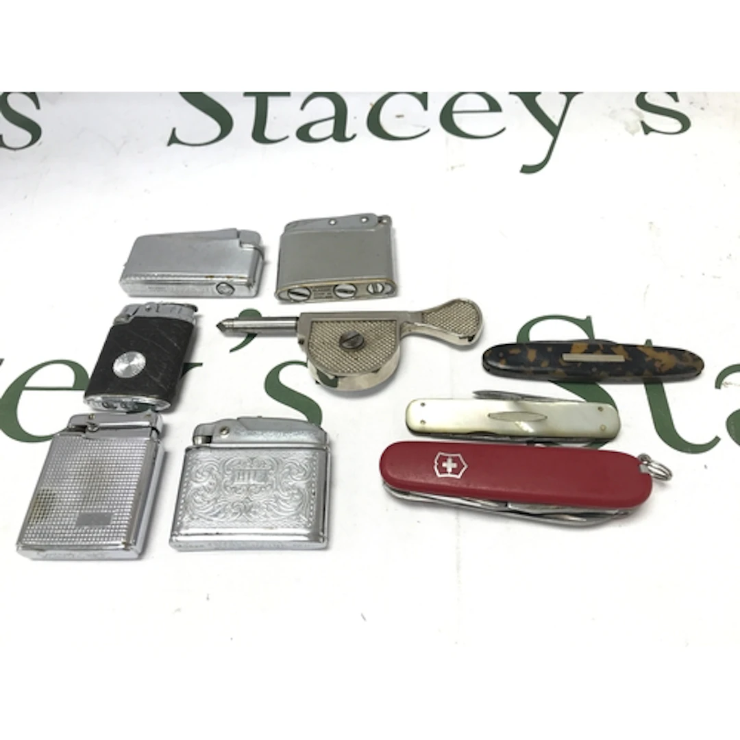 A Collection of vintage lighters and pocket knives
