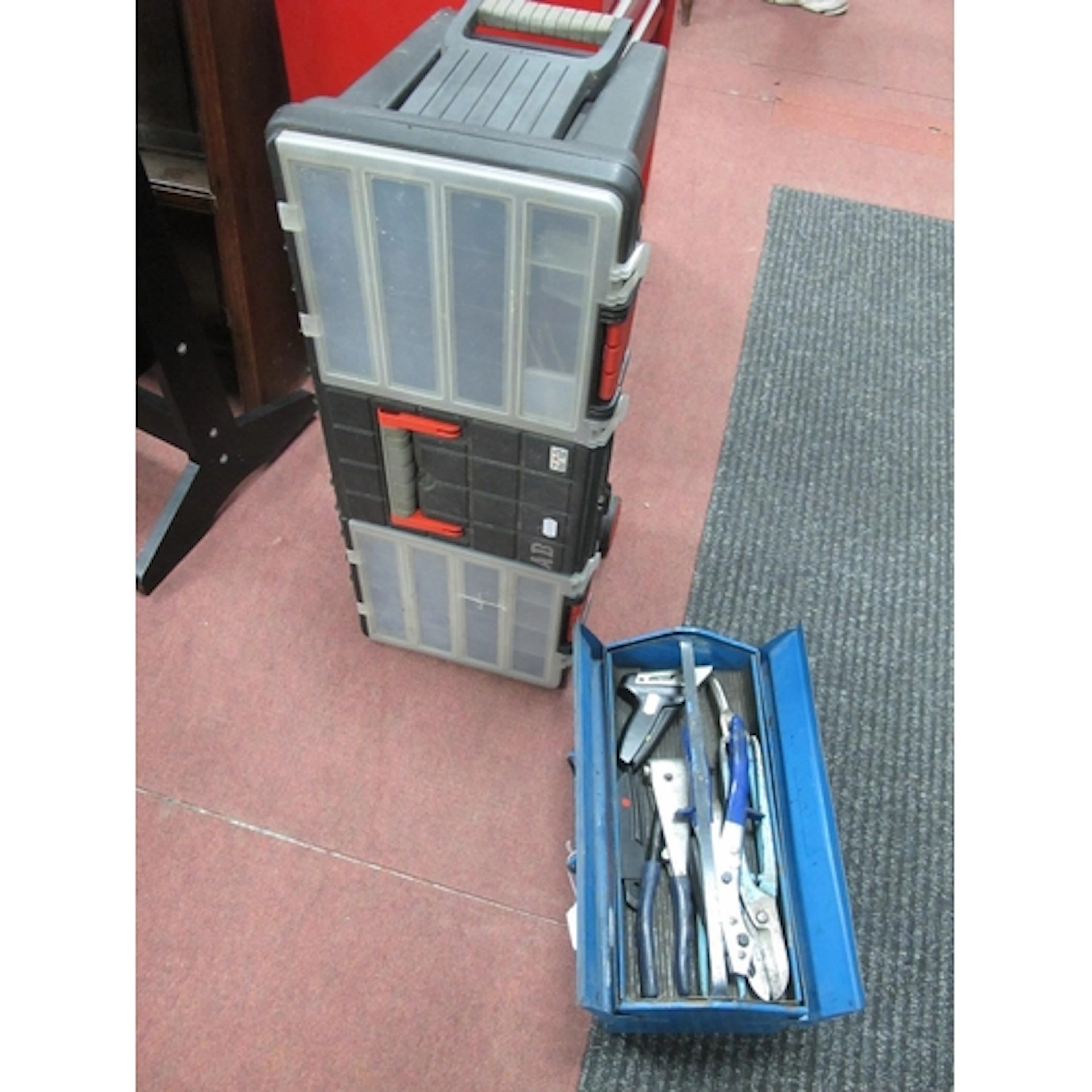 A multi-level ZAG wheeled rolling toolbox with blue metal ca...