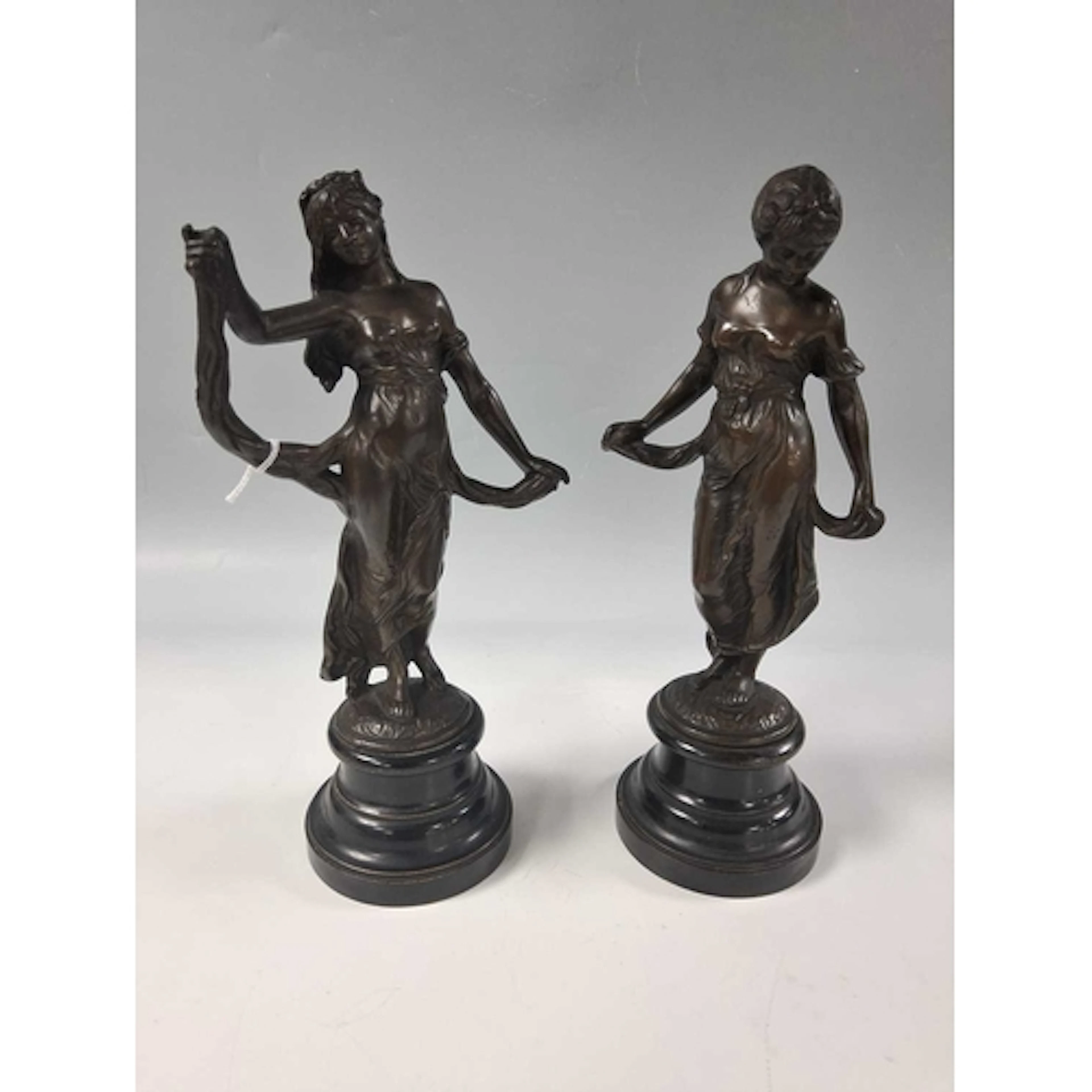 A PAIR OF FRENCH ART NOUVEAU PATINATED BRONZE ALLEGORICAL FI...