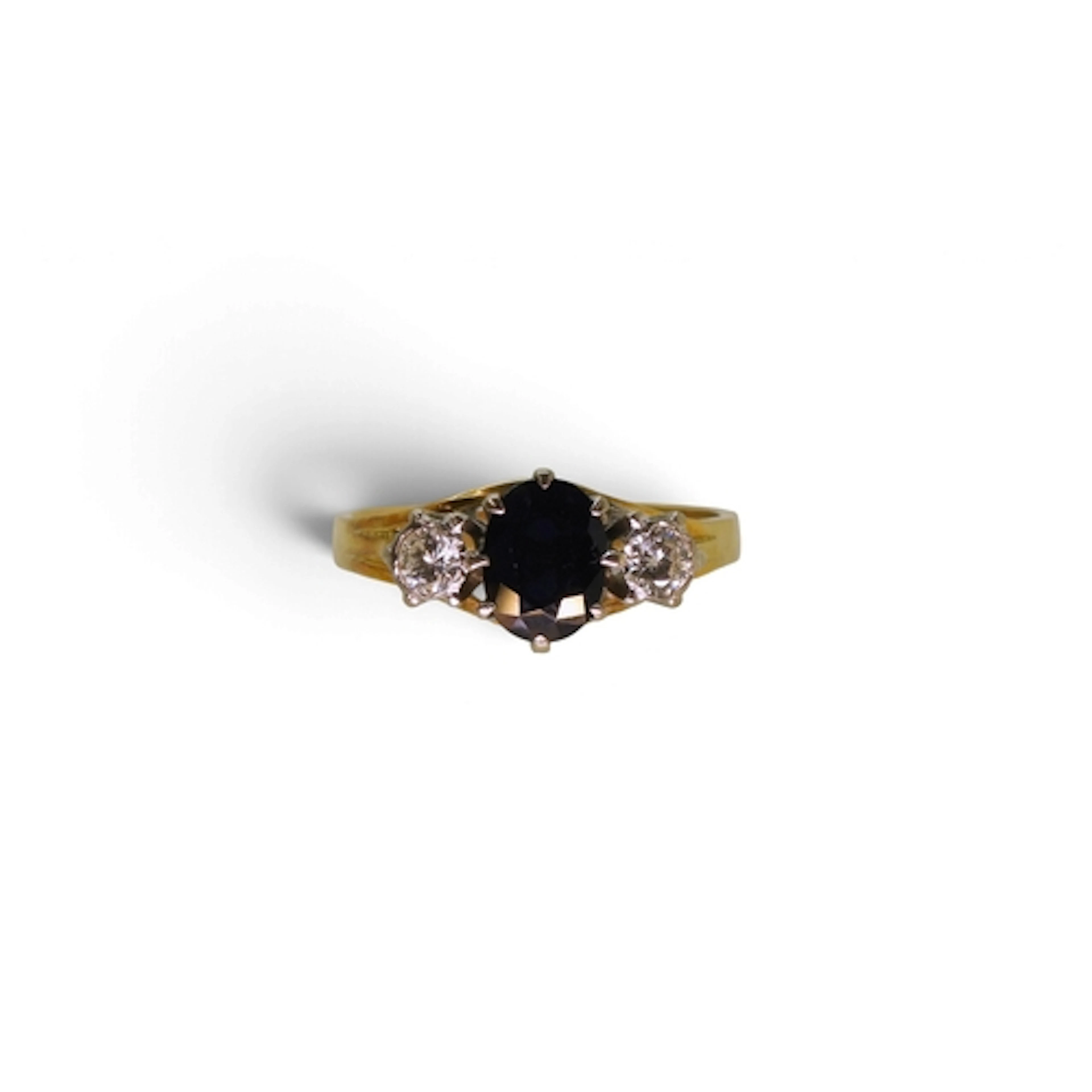 An 18ct gold sapphire and diamond three stone ring, set with...