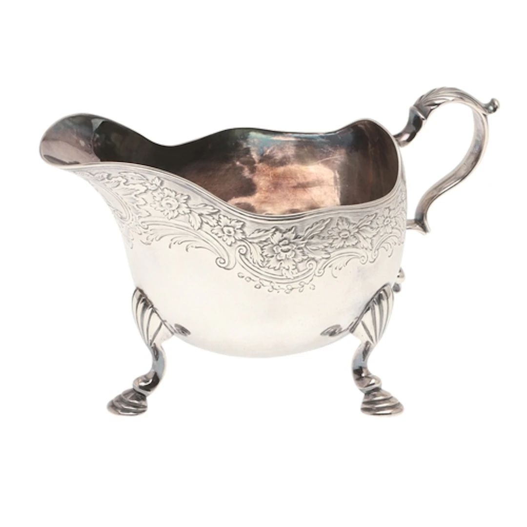 A GEORGE II SILVER SAUCEBOAT. The boat shape body with an en...