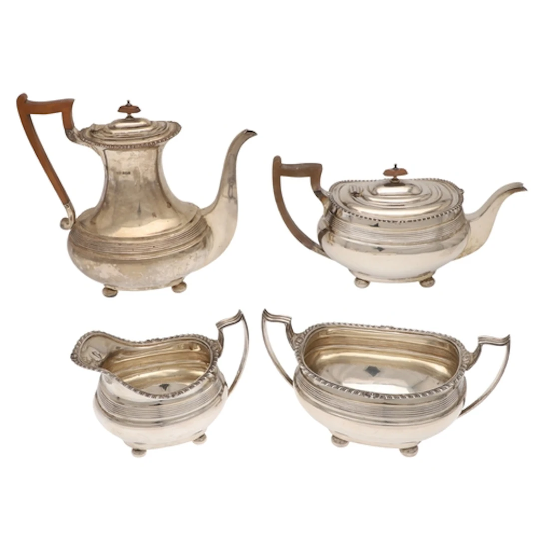 AN EARLY GEORGE V SILVER FOUR PIECE TEA SET. To include a Te...