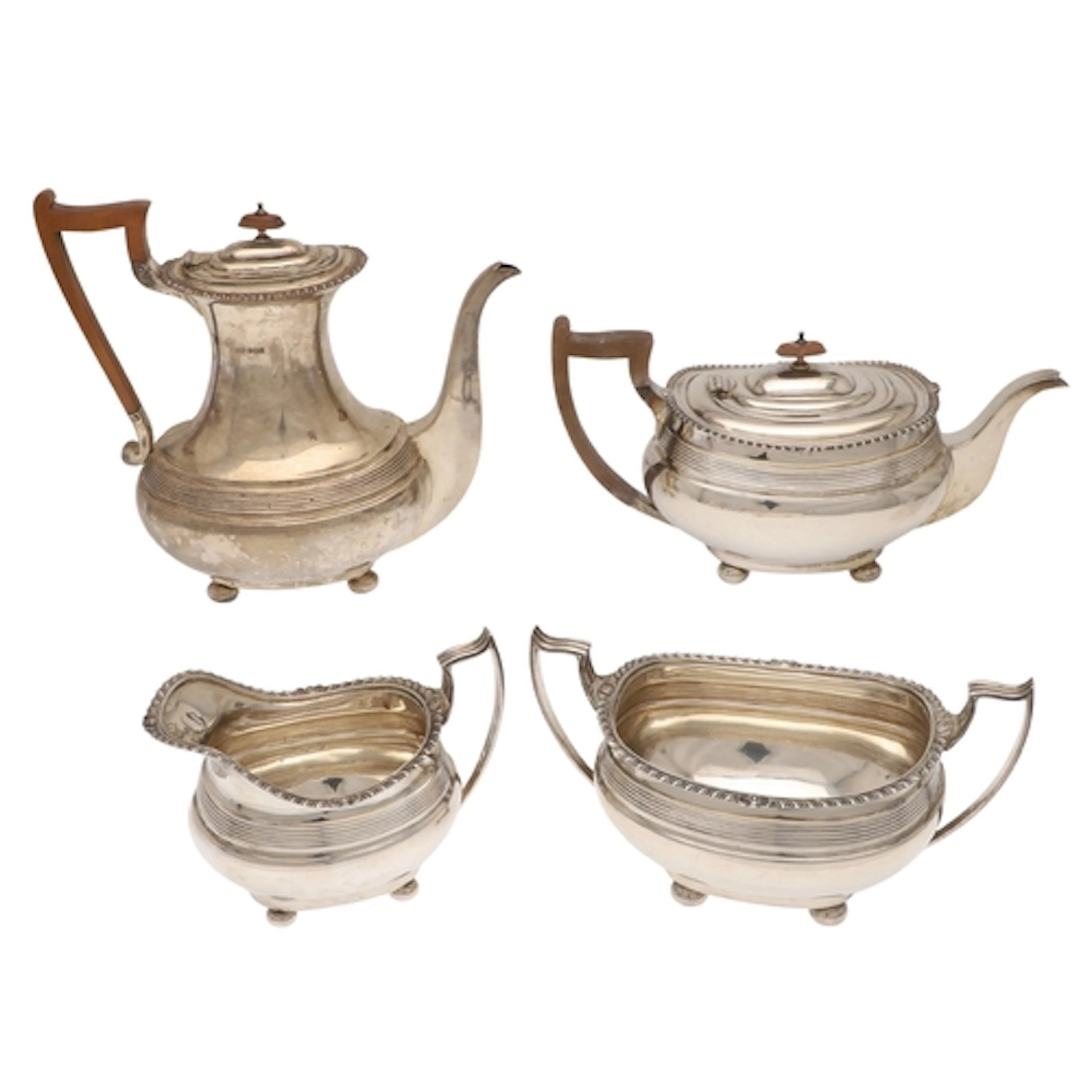 AN EARLY GEORGE V SILVER FOUR PIECE TEA SET. To include a Te...