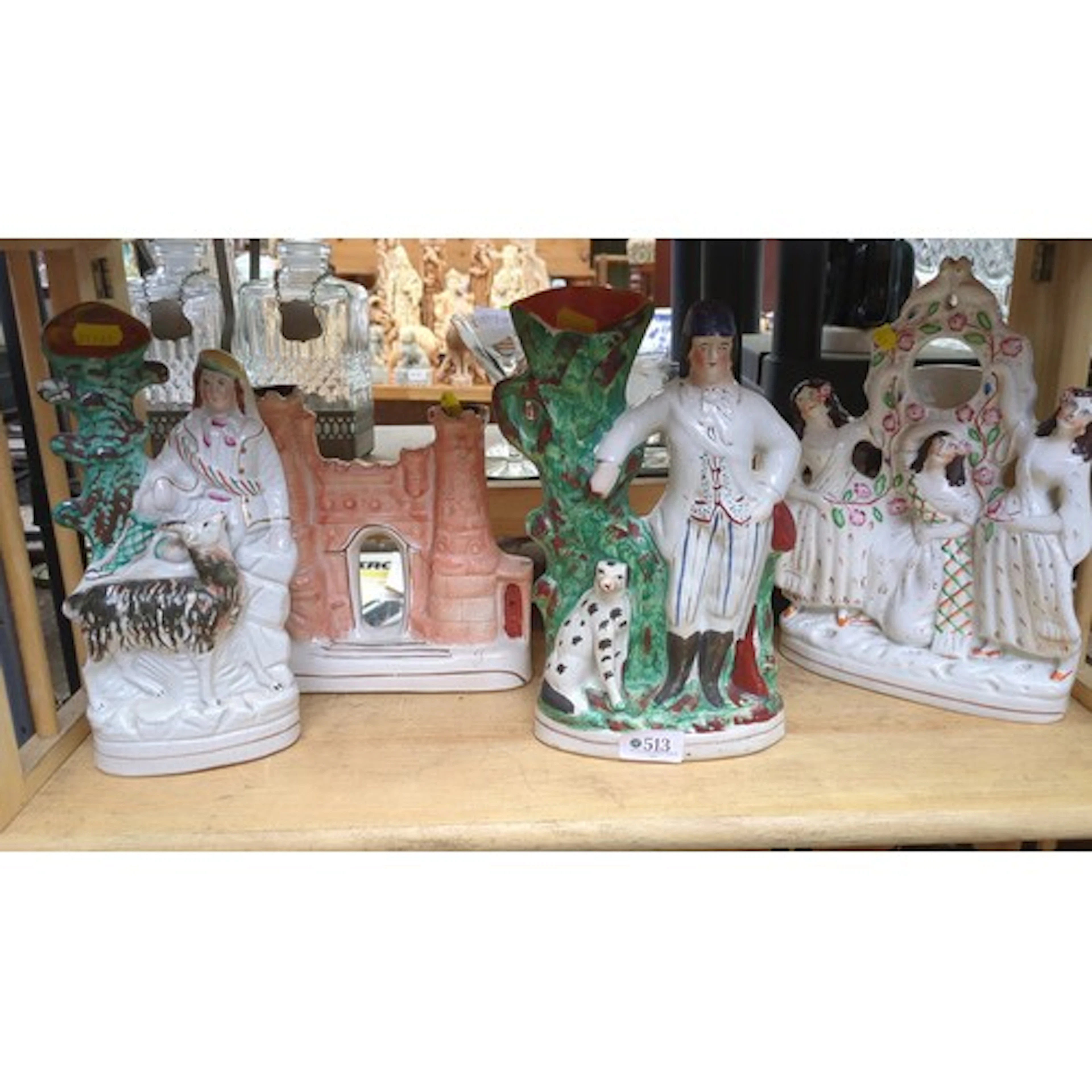 A group of Staffordshire-style polychrome flatback figures a...