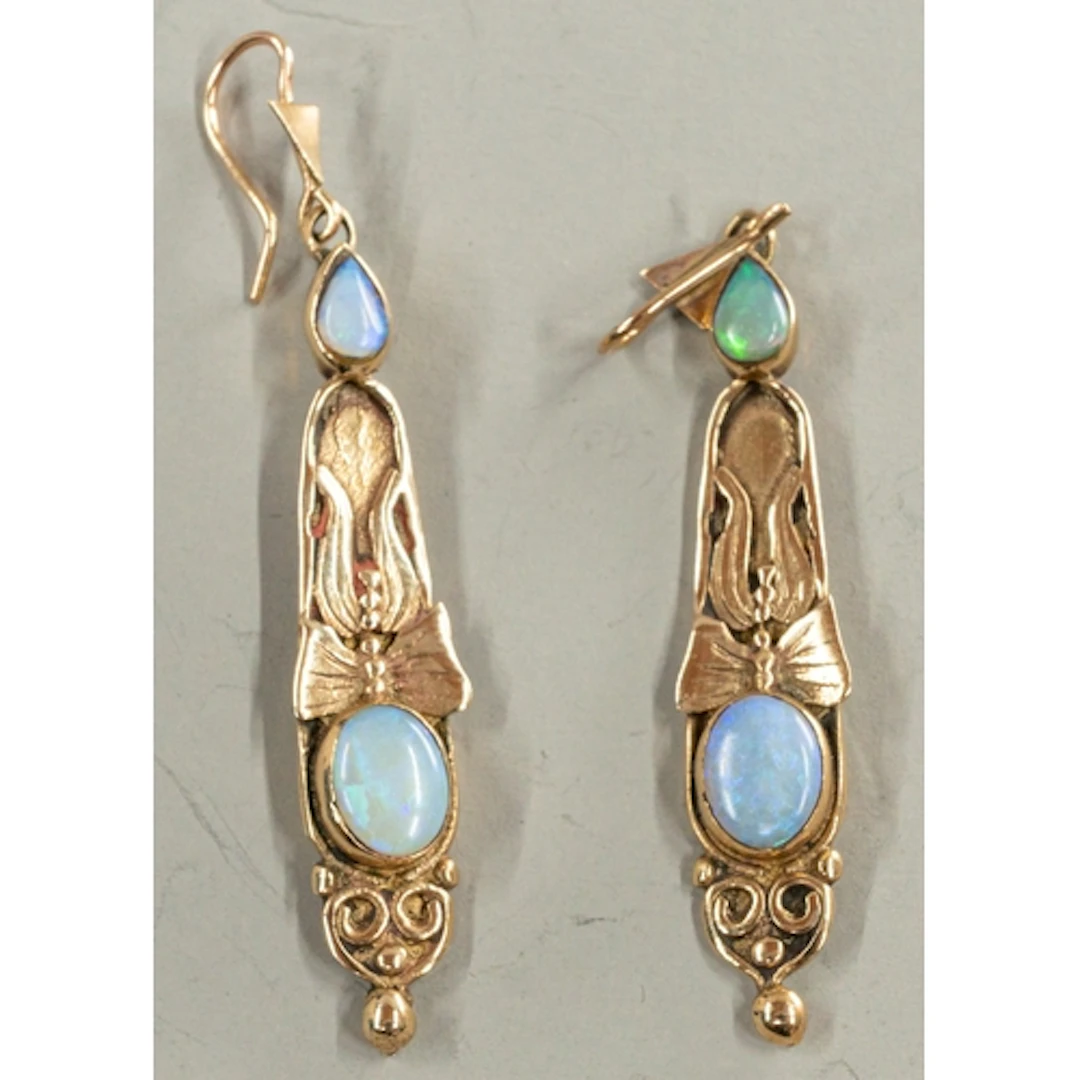 Jewellery: a pair of yellow metal and opal earrings, marked ...