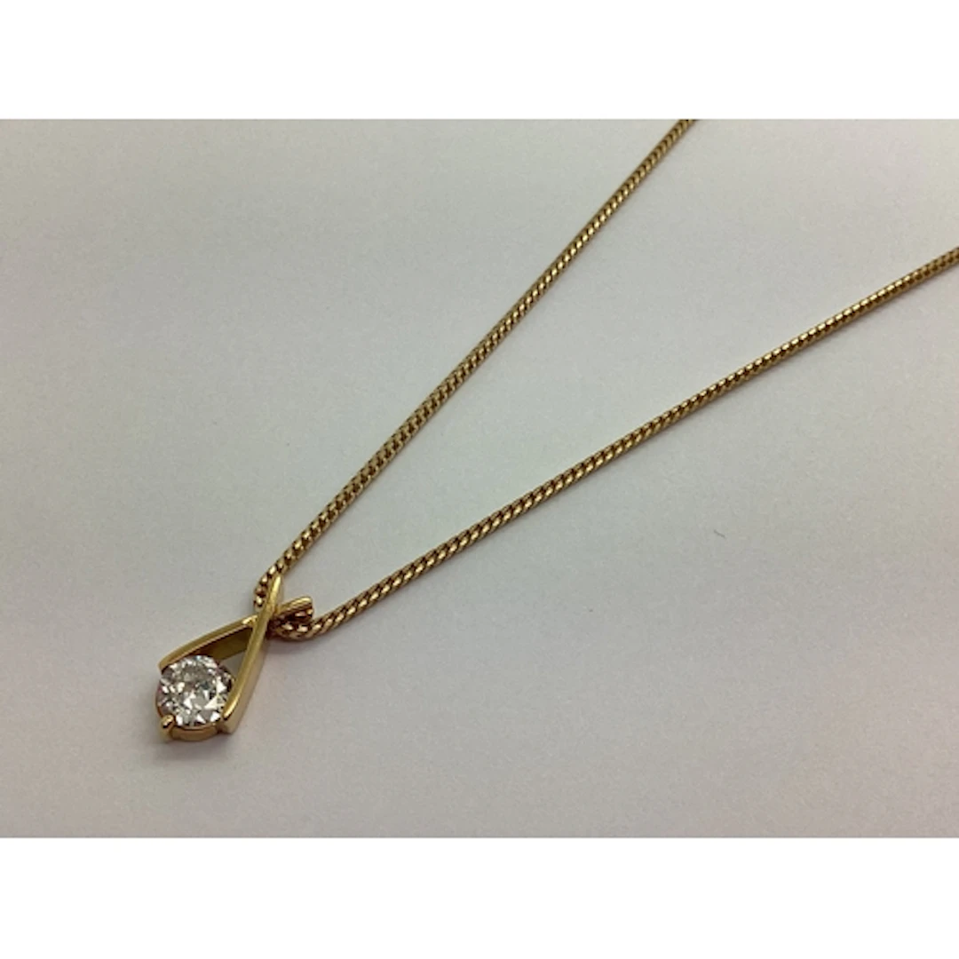 A Modern Single Stone Diamond Pendant, the old cut stone in ...