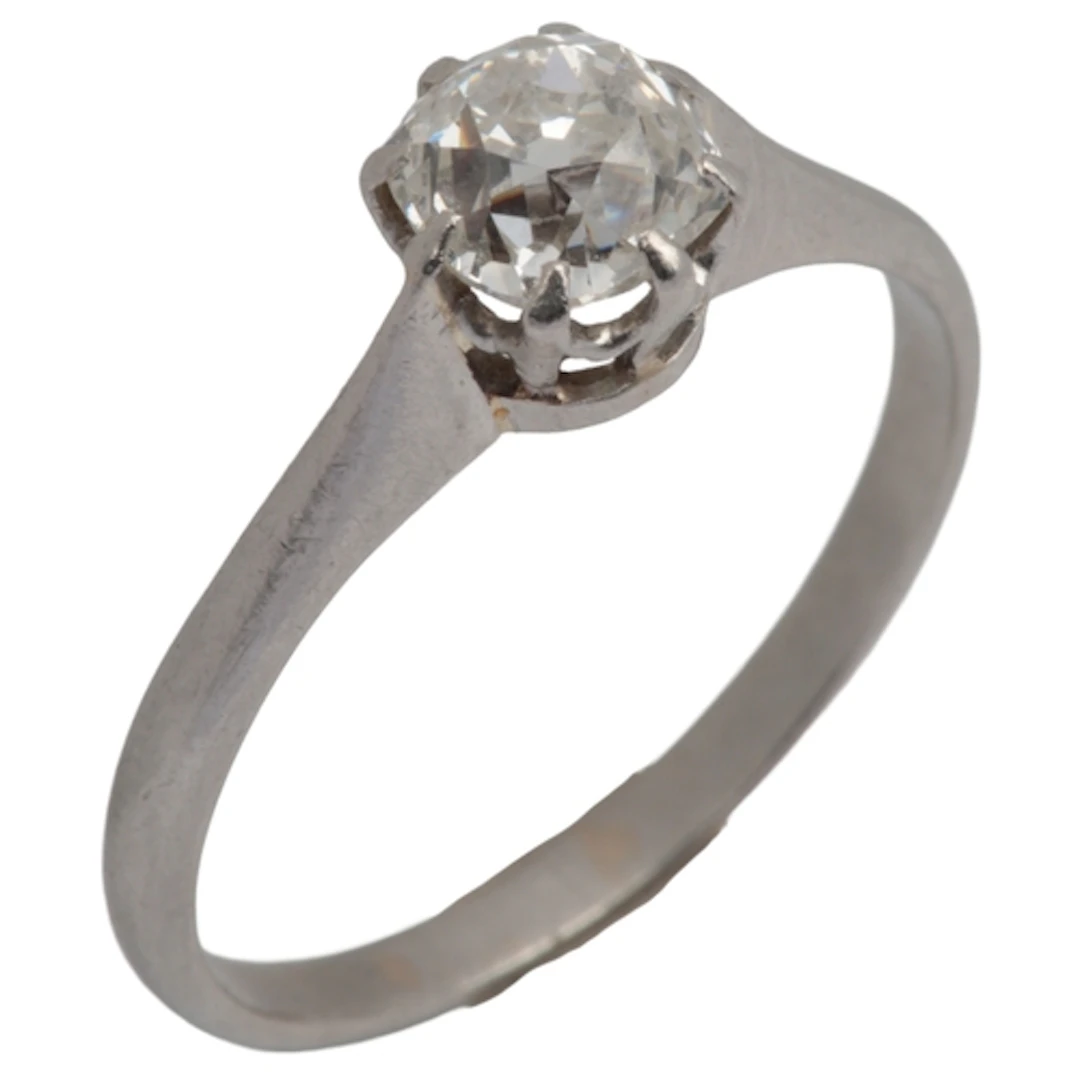 A diamond solitaire ring, early 20th century, claw-set with ...