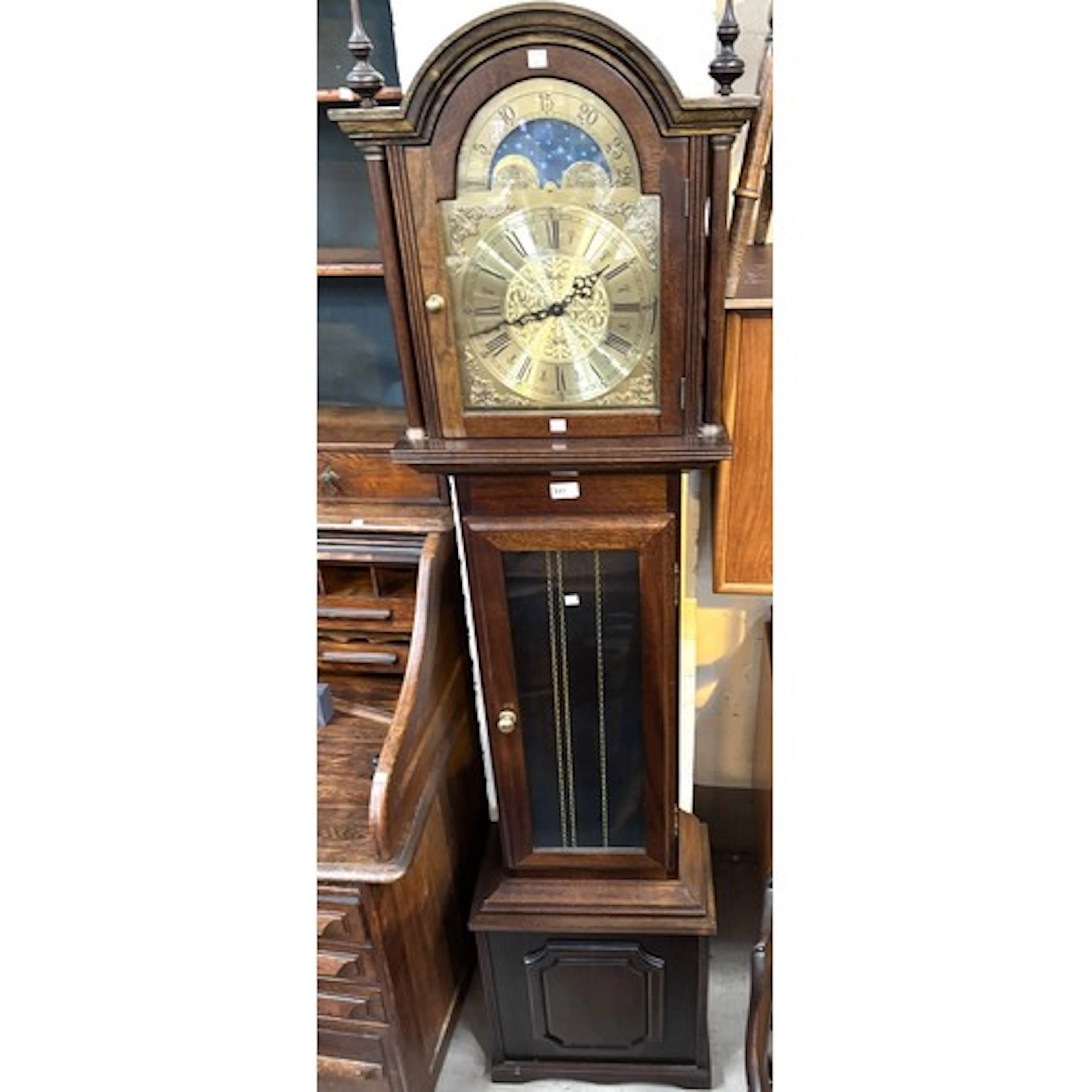 A reproduction longcase clock with weight driven chiming mov...