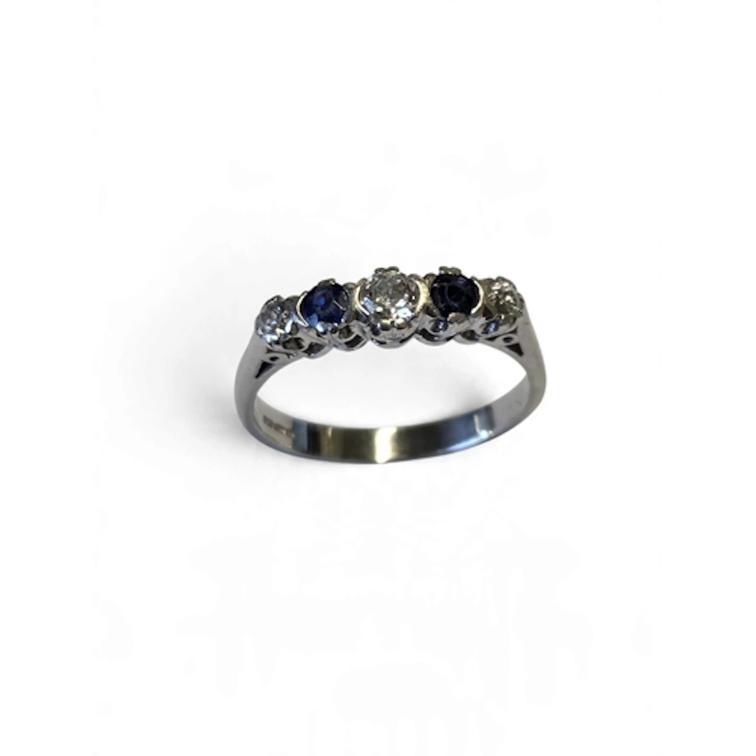 A superb quality platinum five-stone sapphire and diamond ri...
