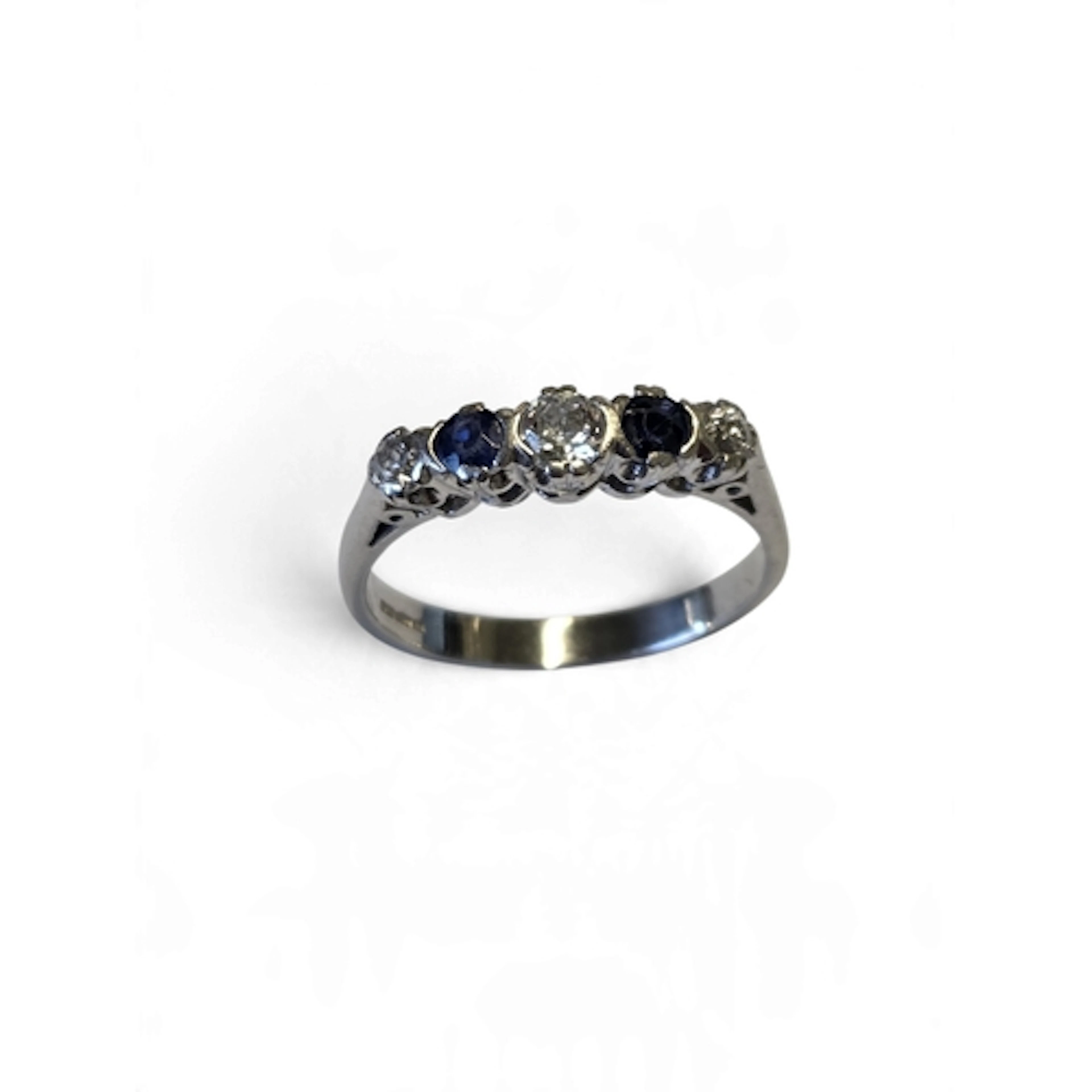 A superb quality platinum five-stone sapphire and diamond ri...