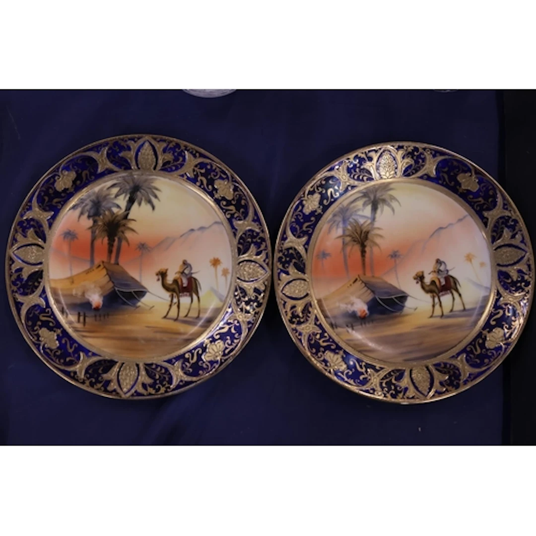 Pair of Noritake vases, both decorated with camel deser...