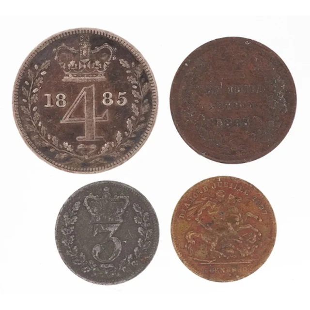 Four Victorian coins and tokens comprising 1885 Maundy fourp...