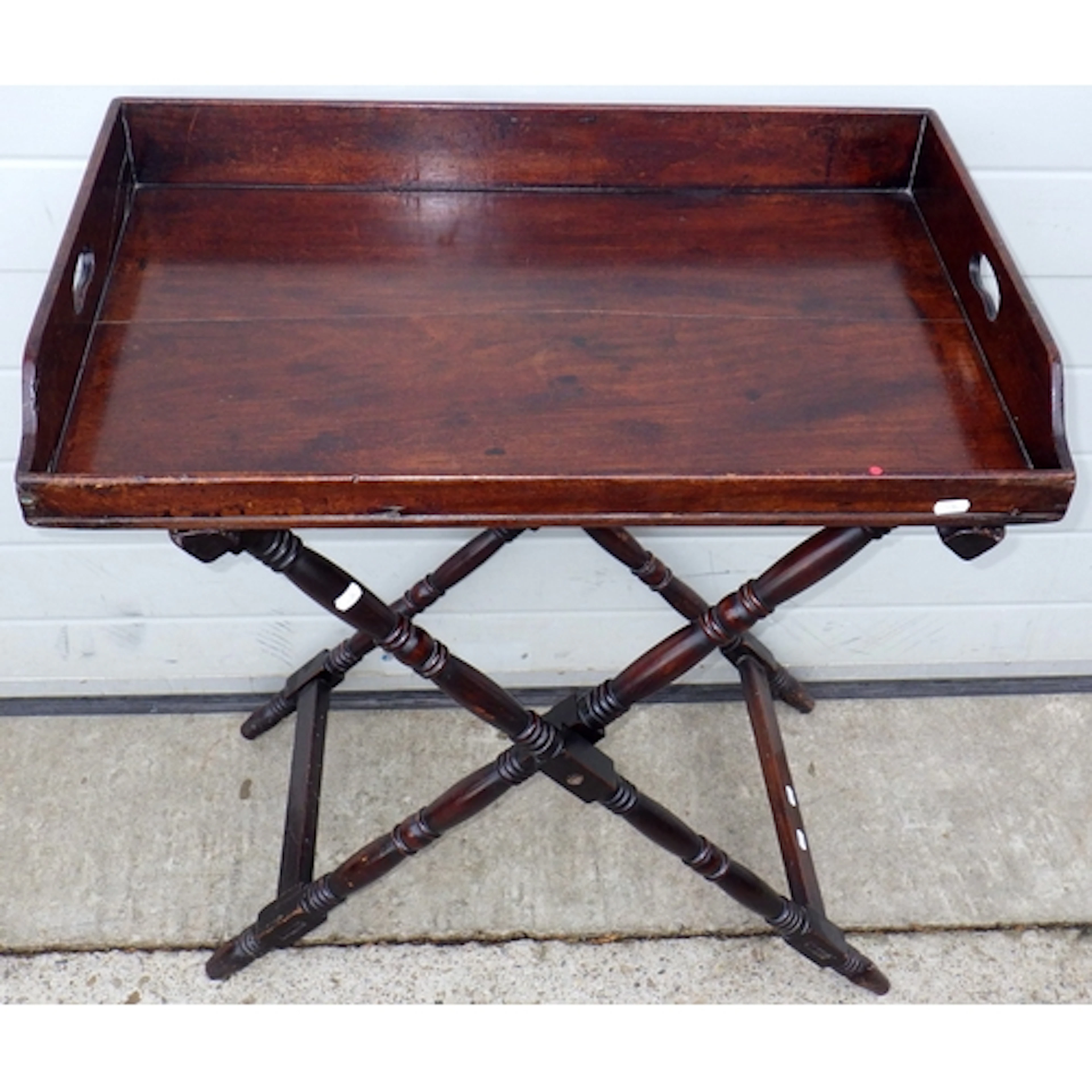 A Regency mahogany butlers tray, 77cm wide on turned stand, ...