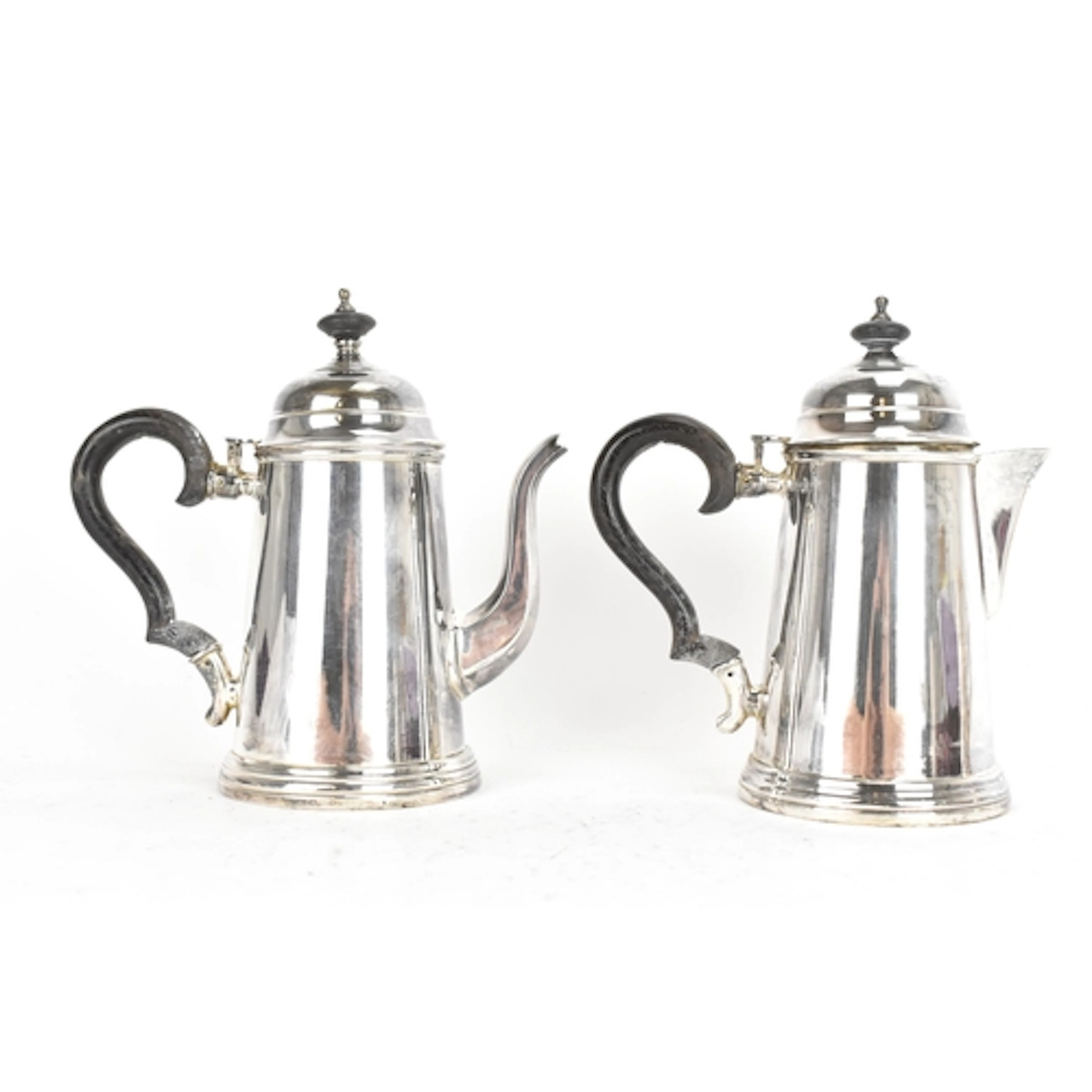 An early 20th century silver plated coffee pot and hot water...