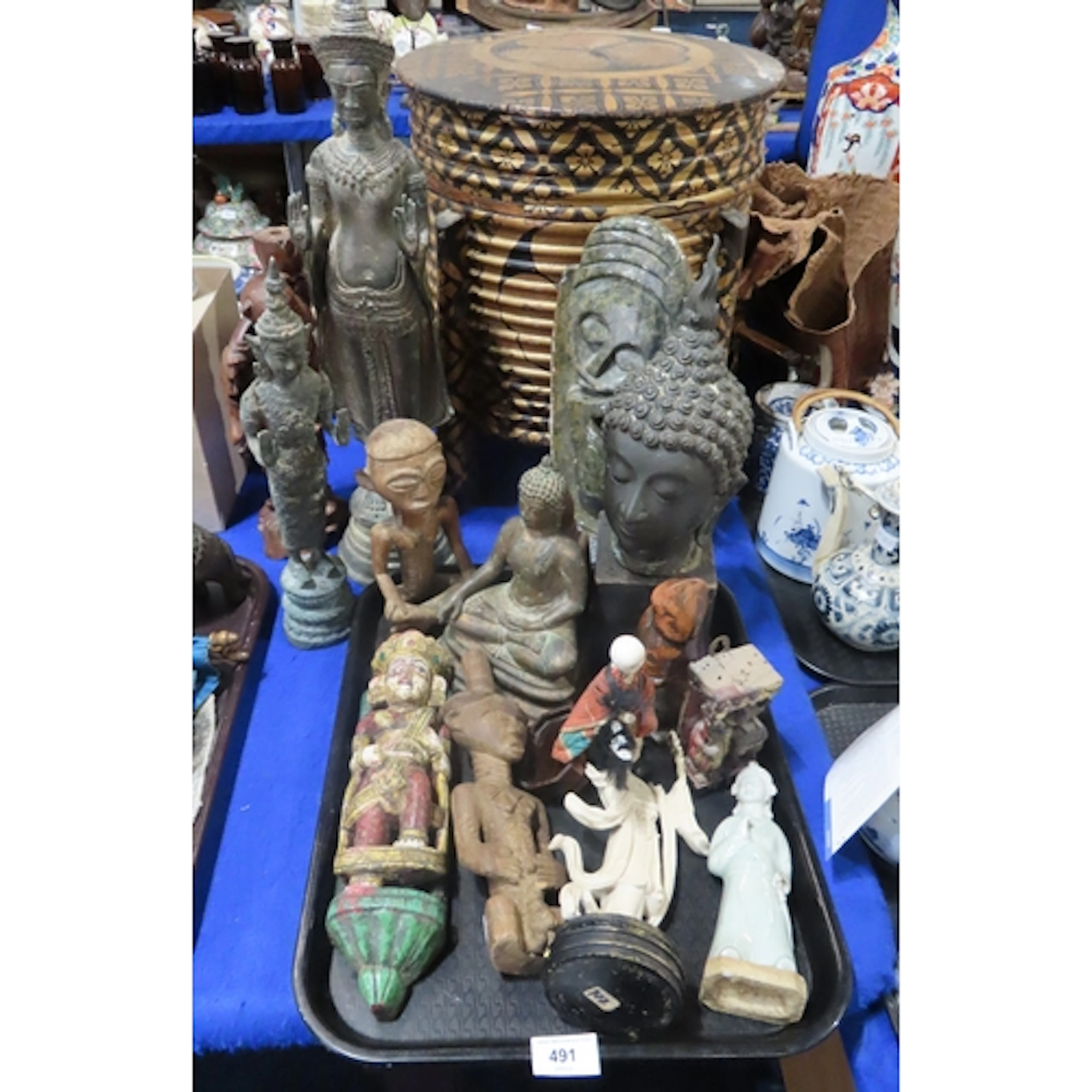 A Khmer style bronze buddha, another smaller example, a carv...