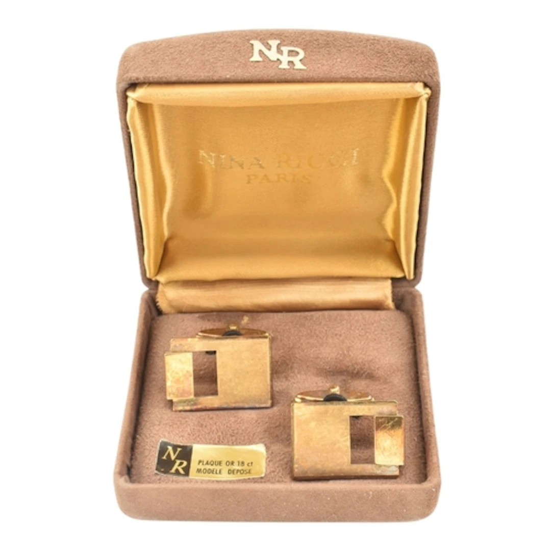 A pair of late mid century Nina Ricci gold plated cufflinks,...
