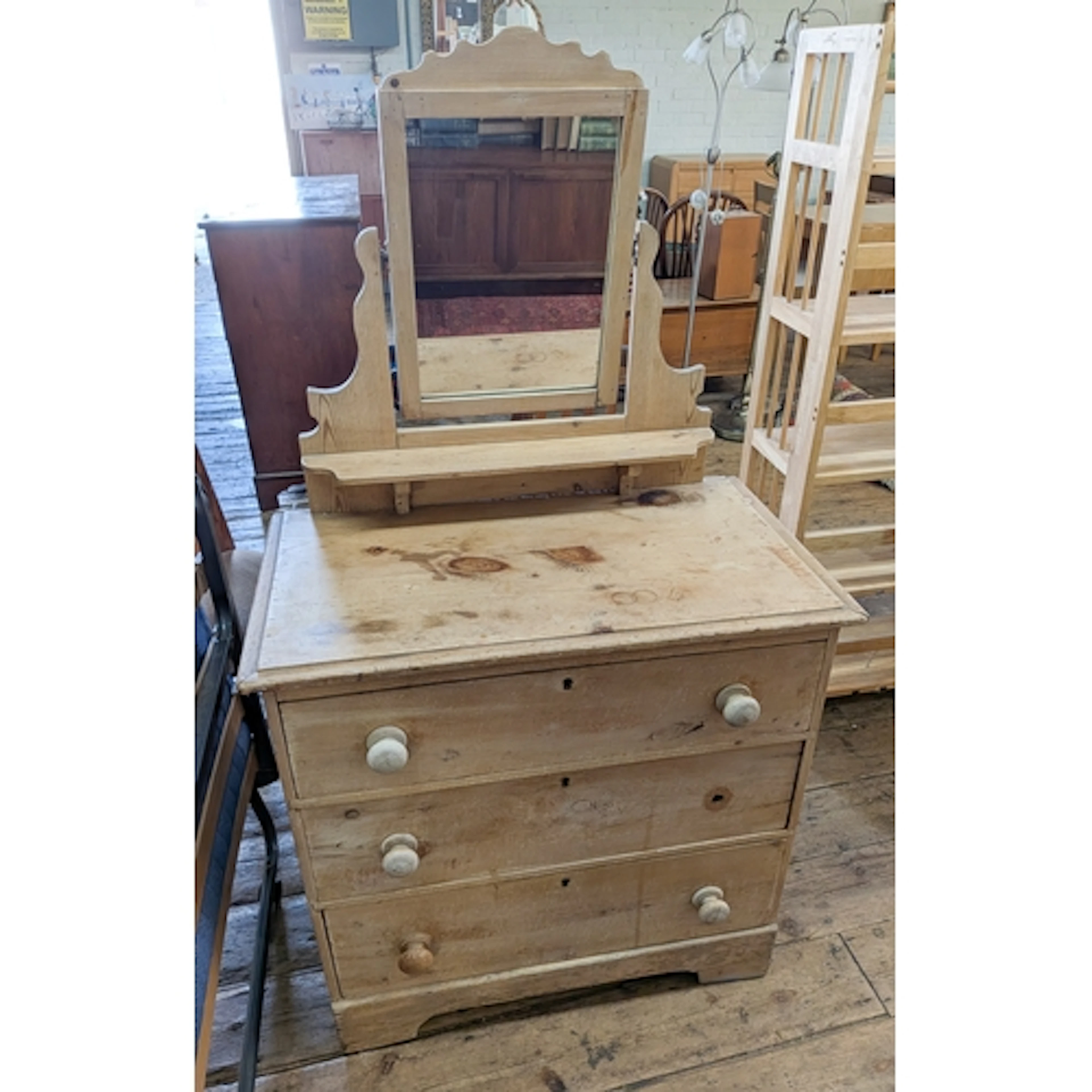 A Victorian stripped pine dressing chest fitted three drawer...