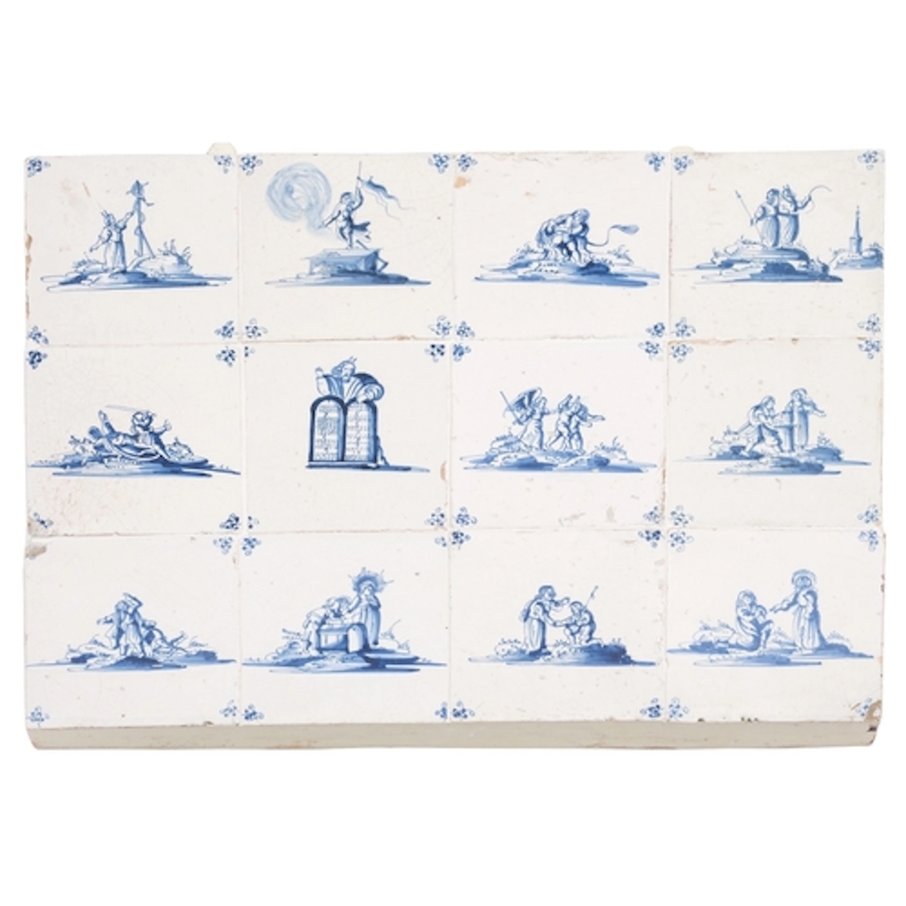 A panel of twelve Dutch Delft tiles painted in blue with bib...