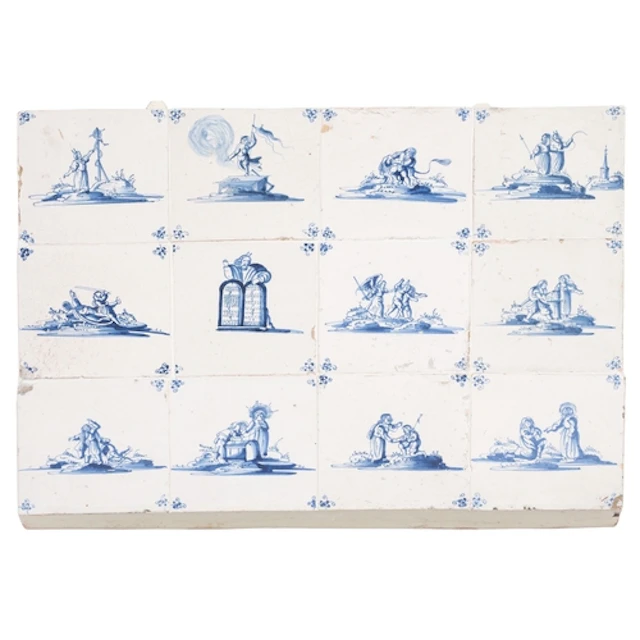 A panel of twelve Dutch Delft tiles painted in blue with bib...