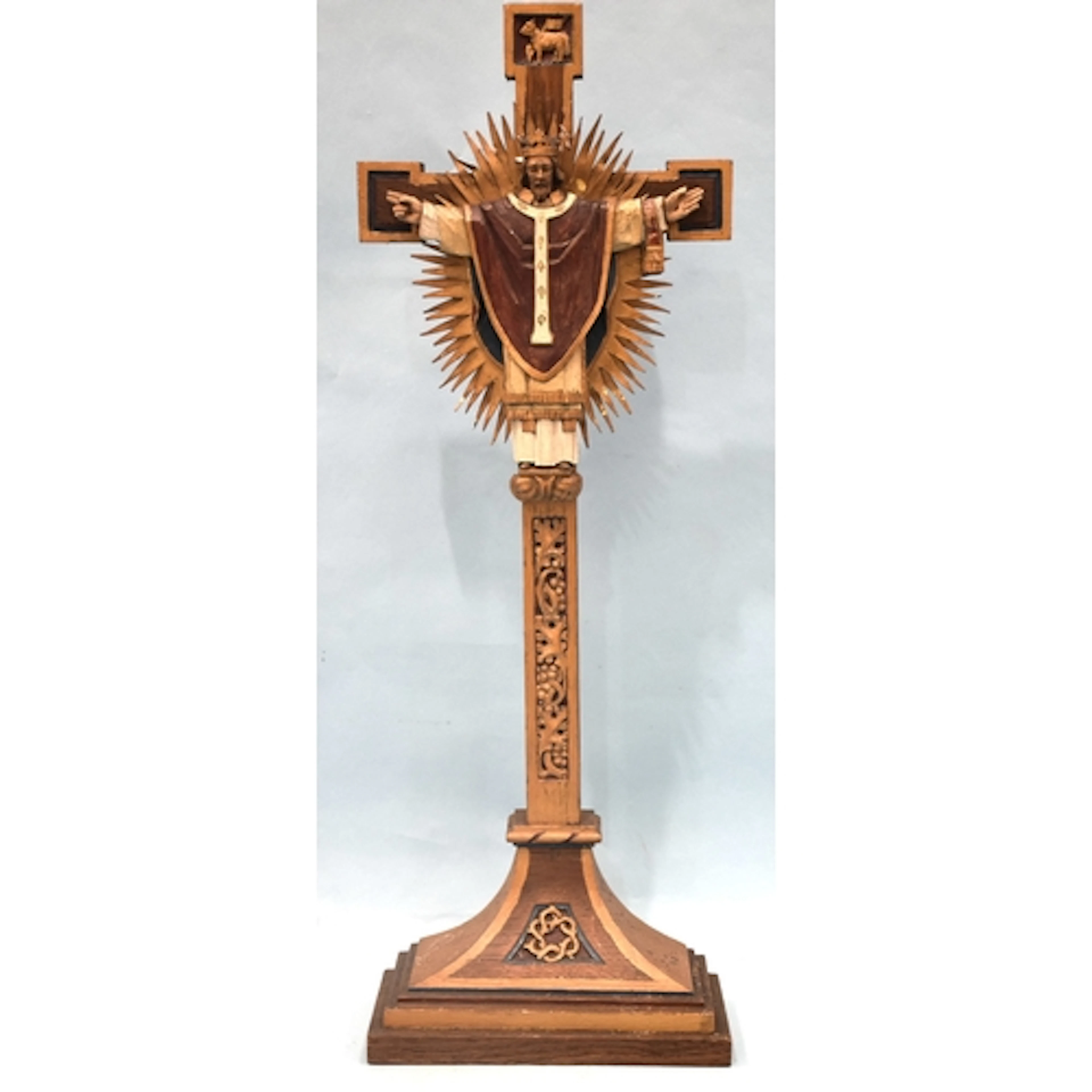 A carved painted wood and metal crucifix, with inscription v...