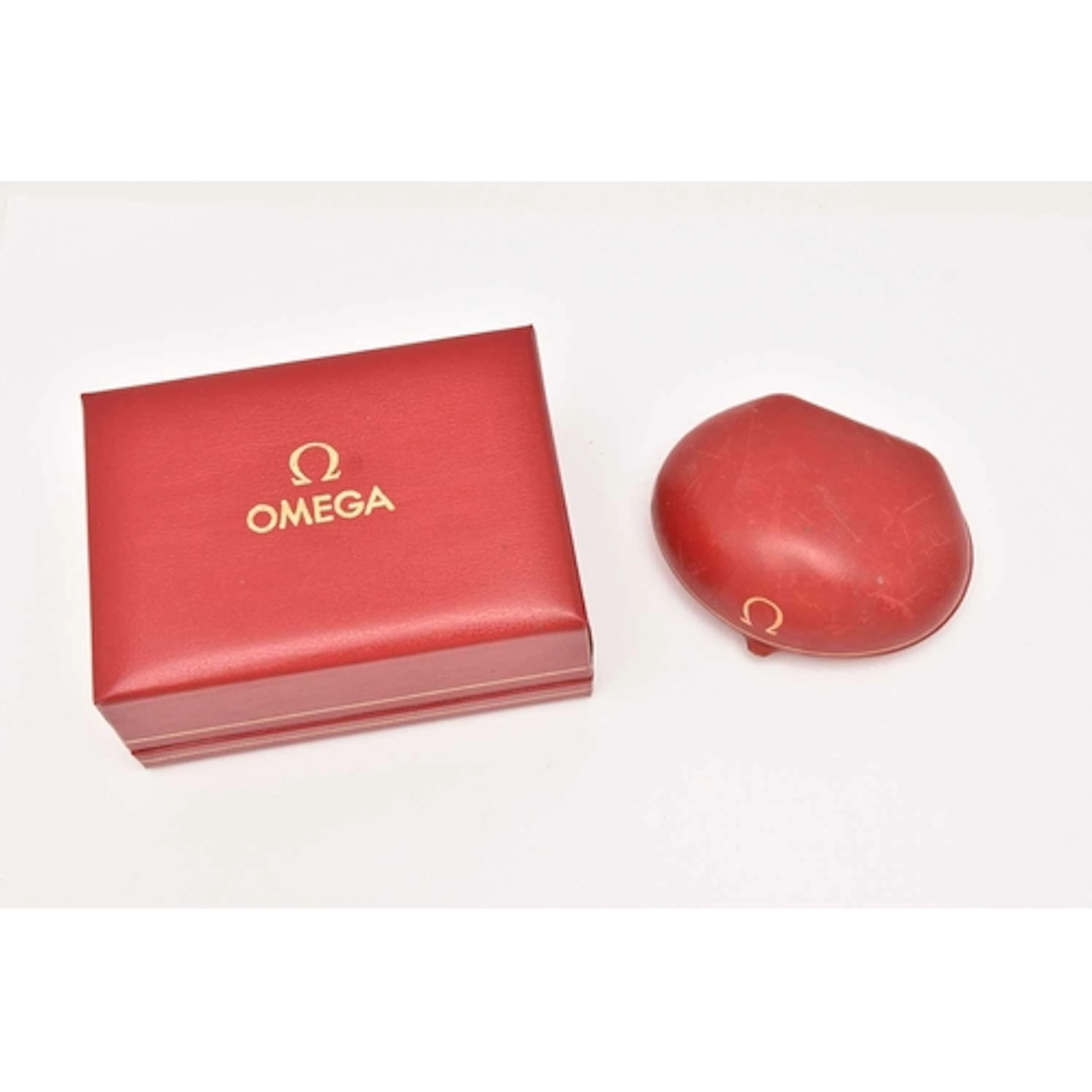 TWO 'OMEGA' WATCH BOXES, two red boxes, signed 'Omega'...