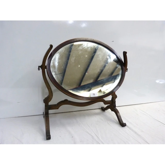Small mahogany framed oval table top mirror.