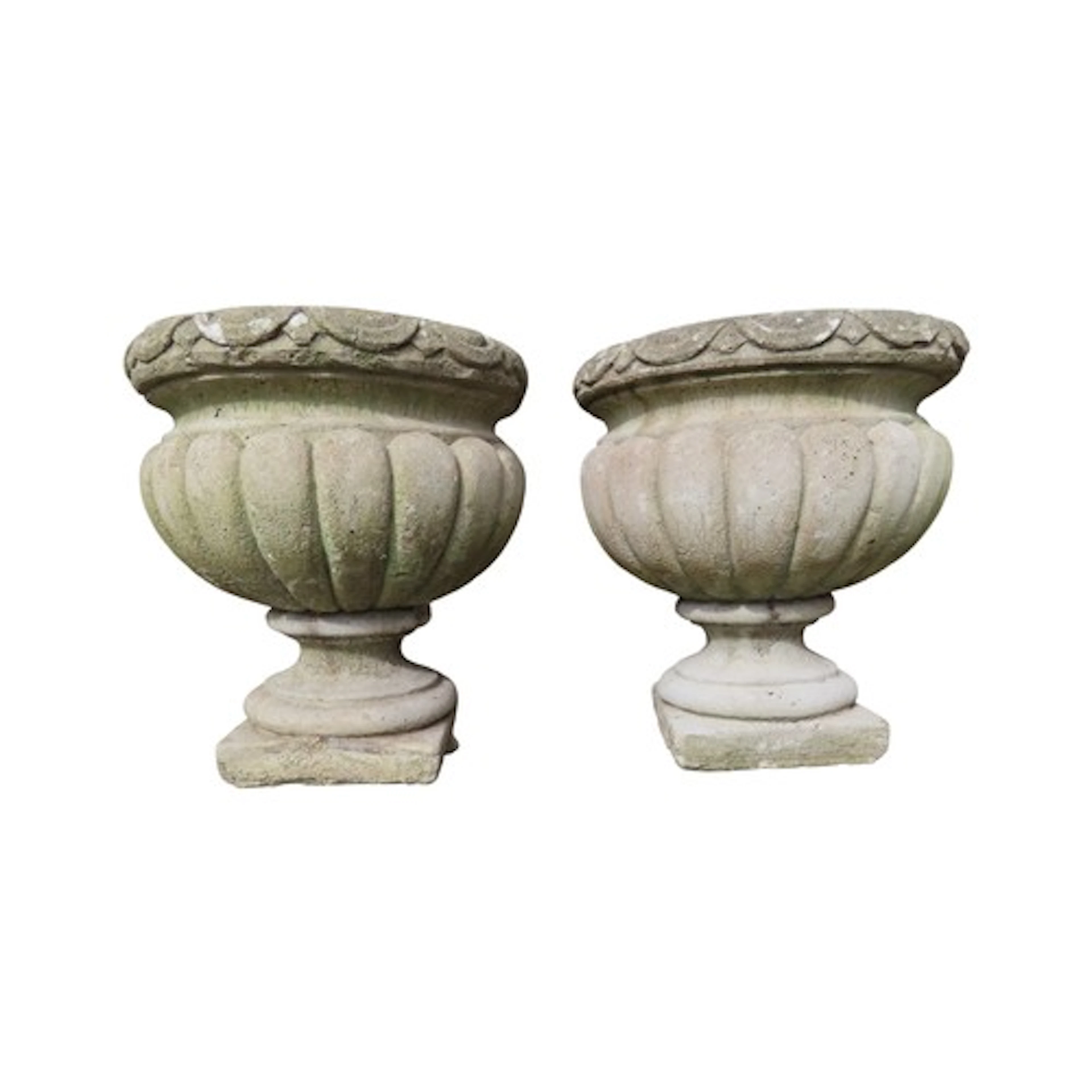 A pair of small weathered cast composition stone garden urns...