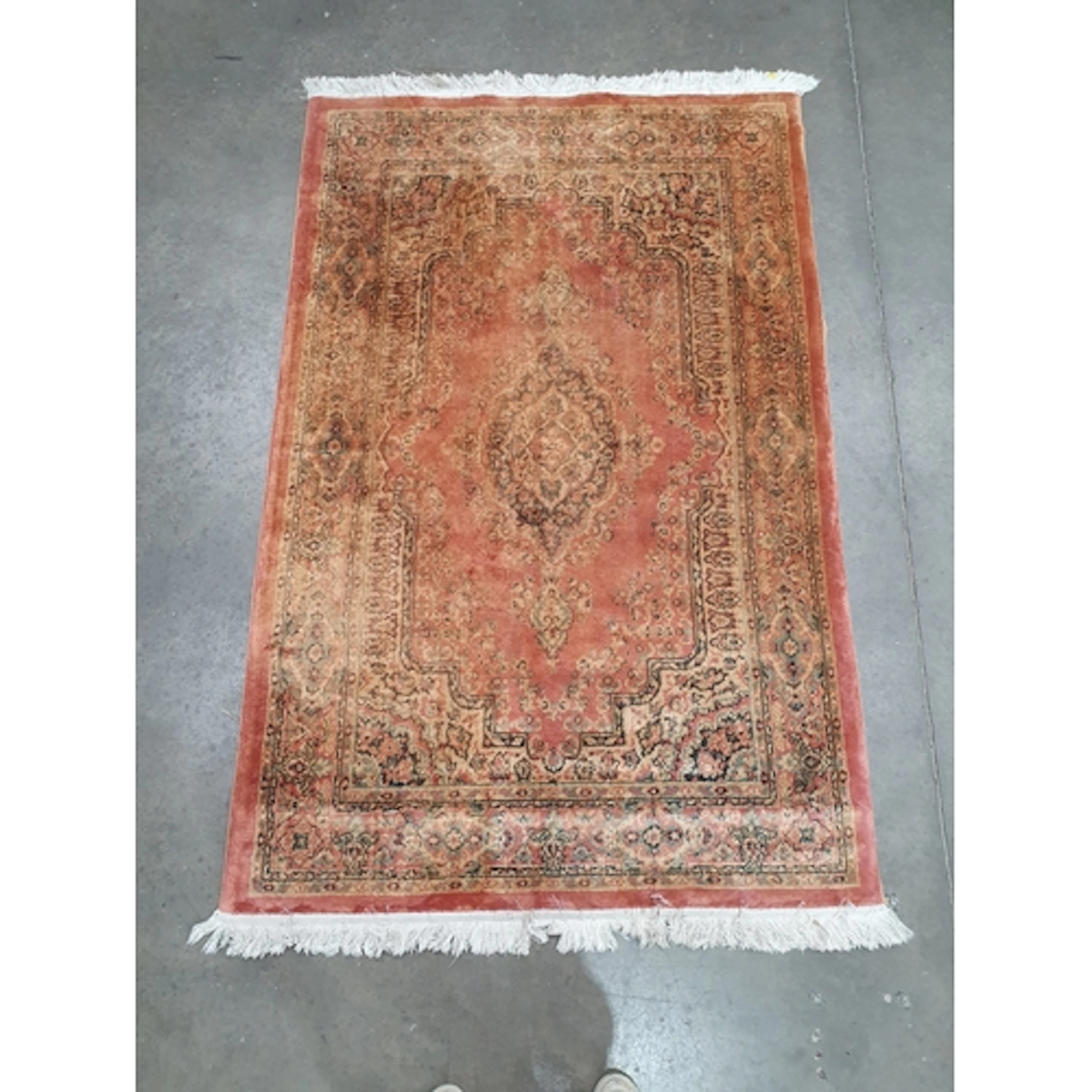 A Persian style Rug on beige and red ground with floral bord...