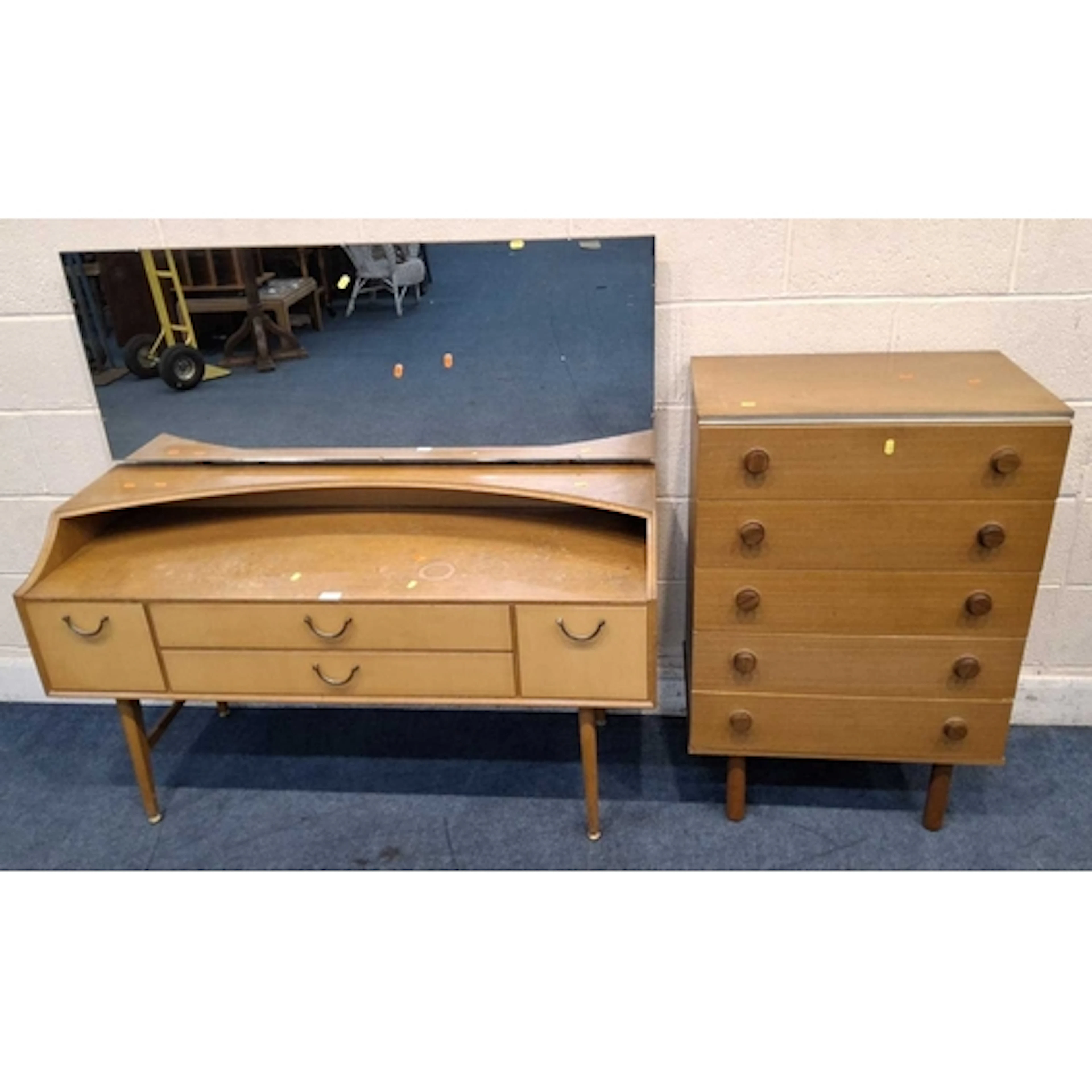 A MID-CENTURY DRESSING TABLE, with a rectangular mirror, fou...