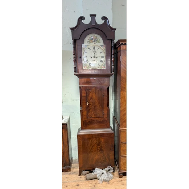 An early 19th century mahogany long case clock with painted ...