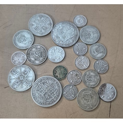 A group of assorted silver coins dated 1920 to 1946, approx....