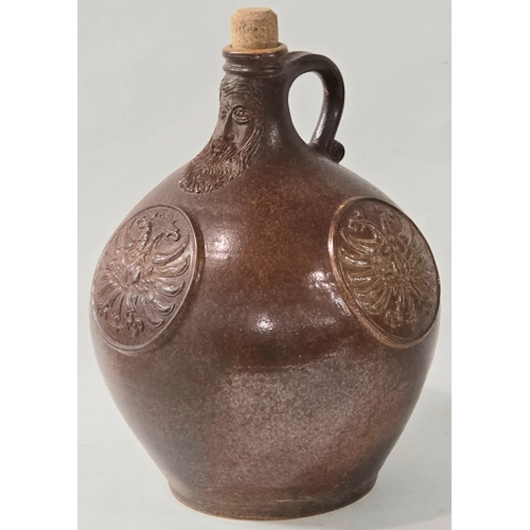 Poole Pottery interest A sale glazed stoneware Bellarmine by...