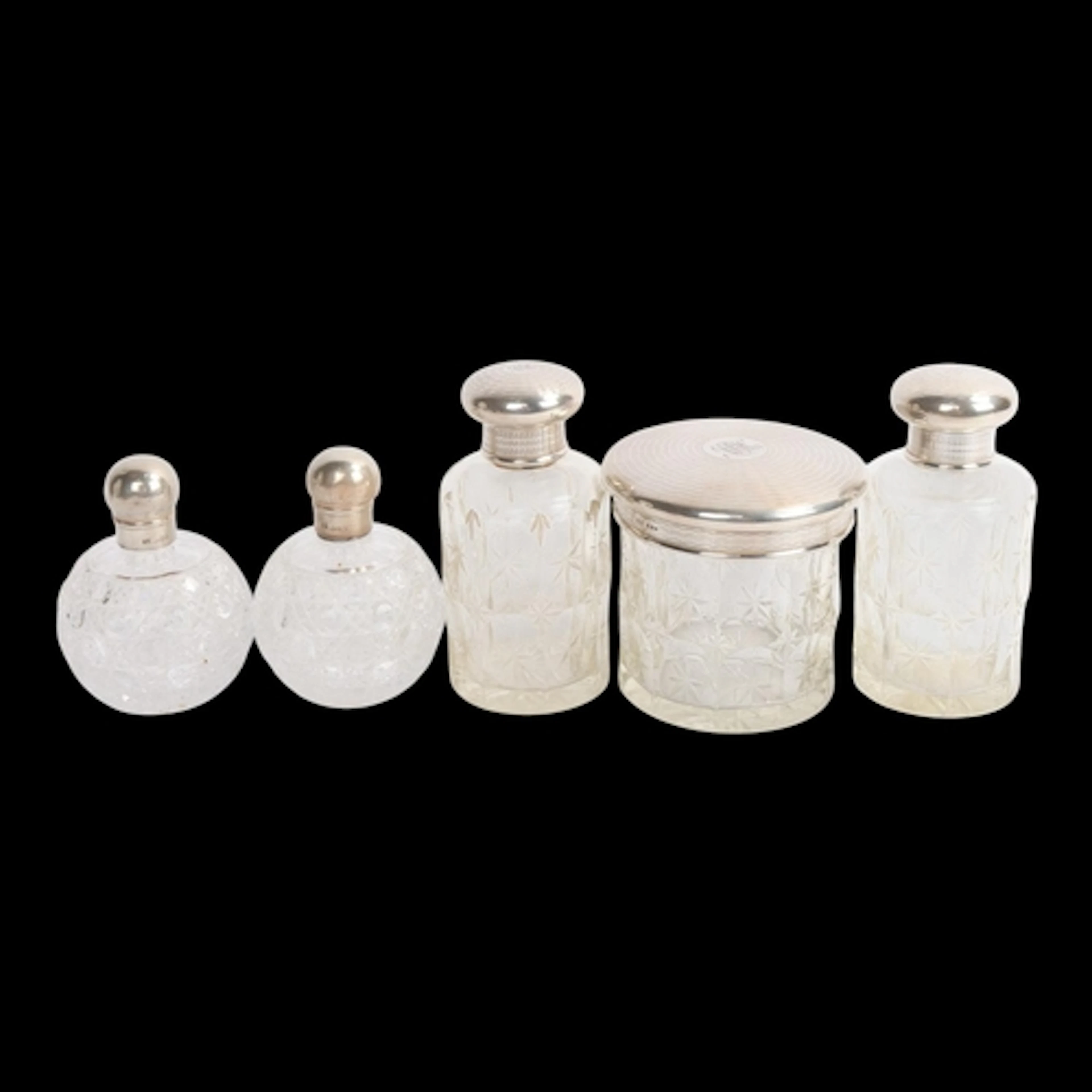 A set of 3 George V silver-mounted glass dressing table jars...