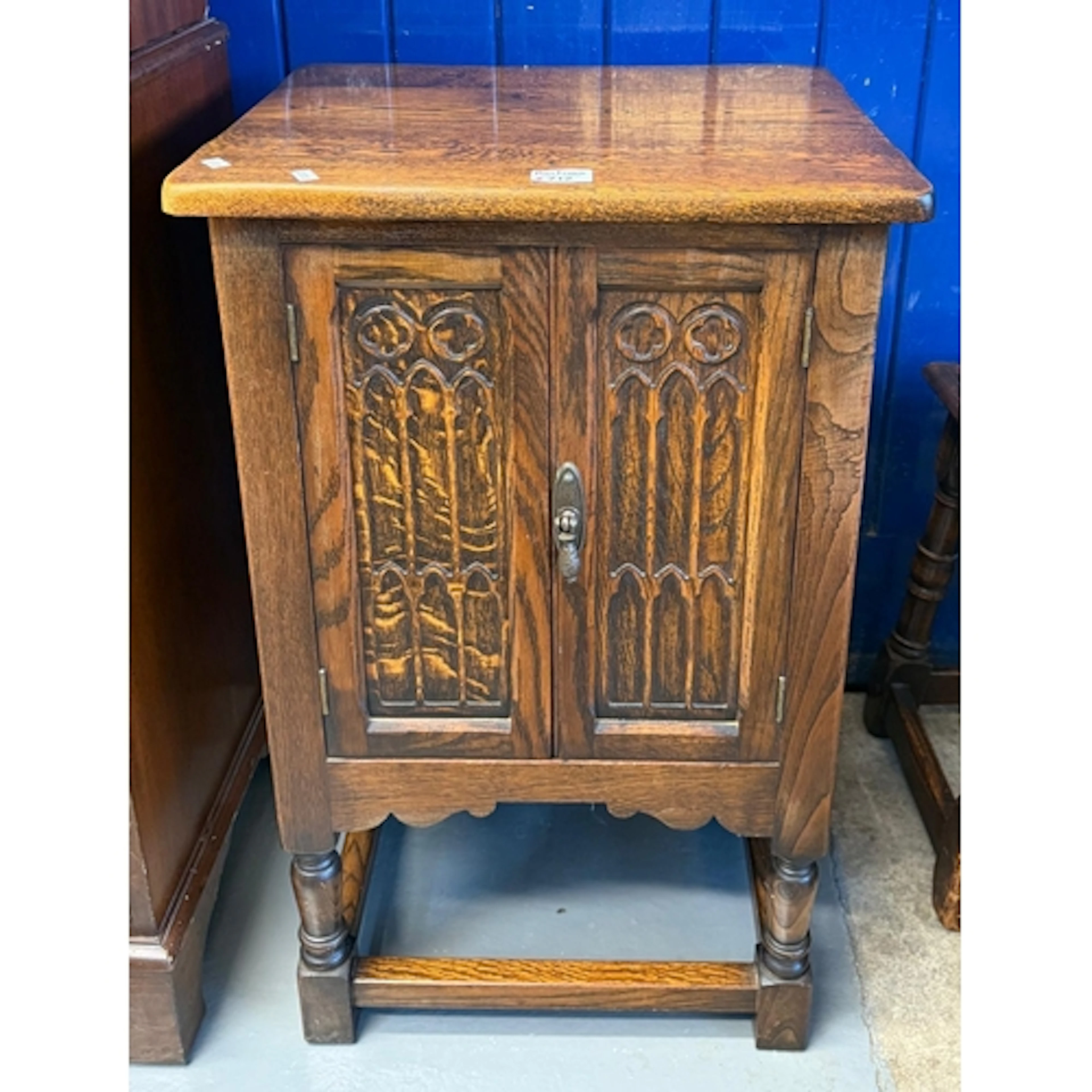 Jacobean style carved oak pedestal cabinet. (B.P. 21% + VAT)
