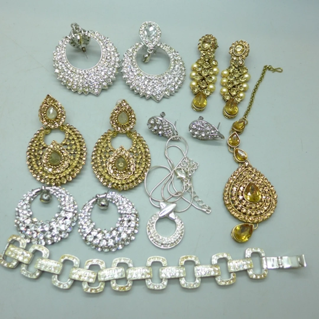 A collection of paste set statement costume jewellery includ...