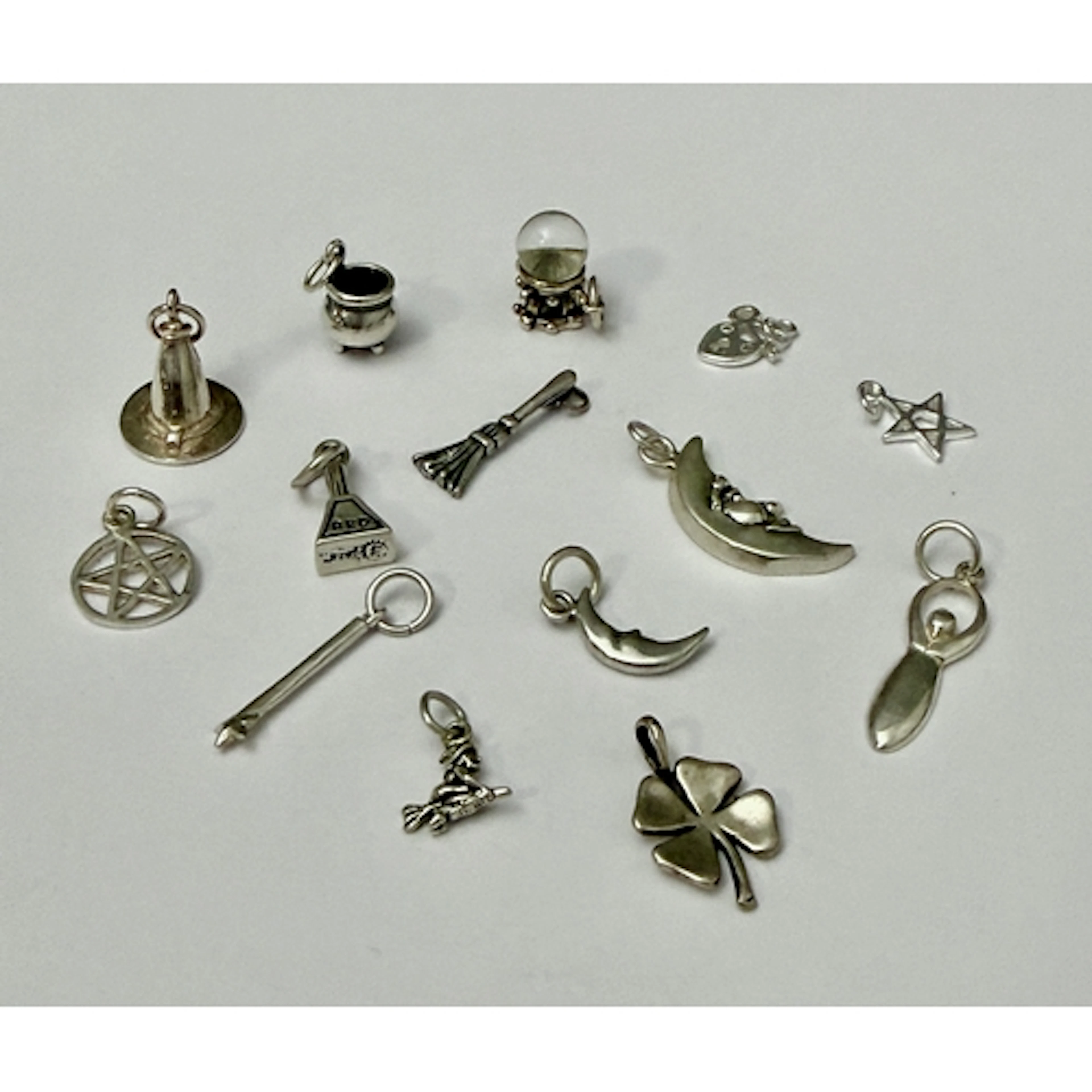 Thirteen sterling silver charms - including a witch's hat; a...