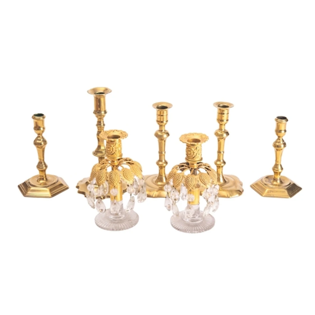 Two pairs of George II brass candlesticks, mid 18th century;...